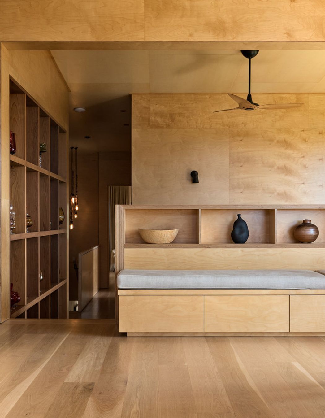 The dining and lounge area features bespoke cabinetry designed by the architect.