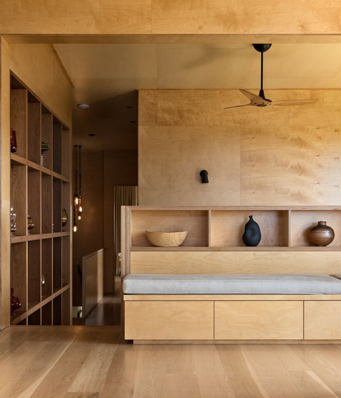 The dining and lounge area features bespoke cabinetry designed by the architect.