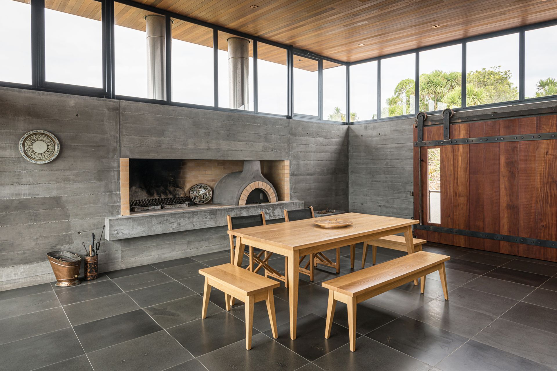 The pizza shop! In the entertainment room, an authentic Italian wood-fired pizza oven was built to satisfy guests. Photograph by ArchiPro.