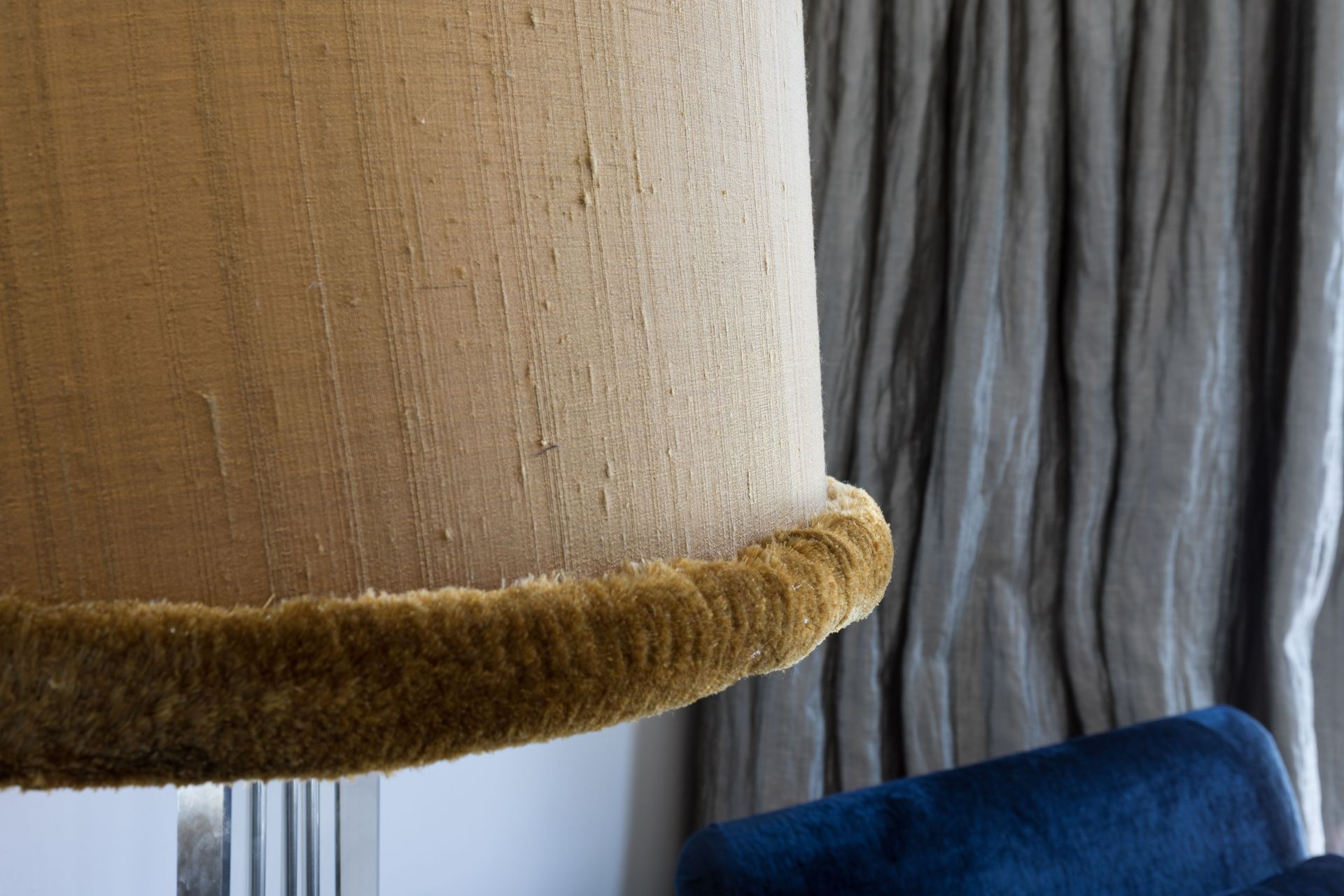 Silk fringing adding a whimsical twist to the floor lamp