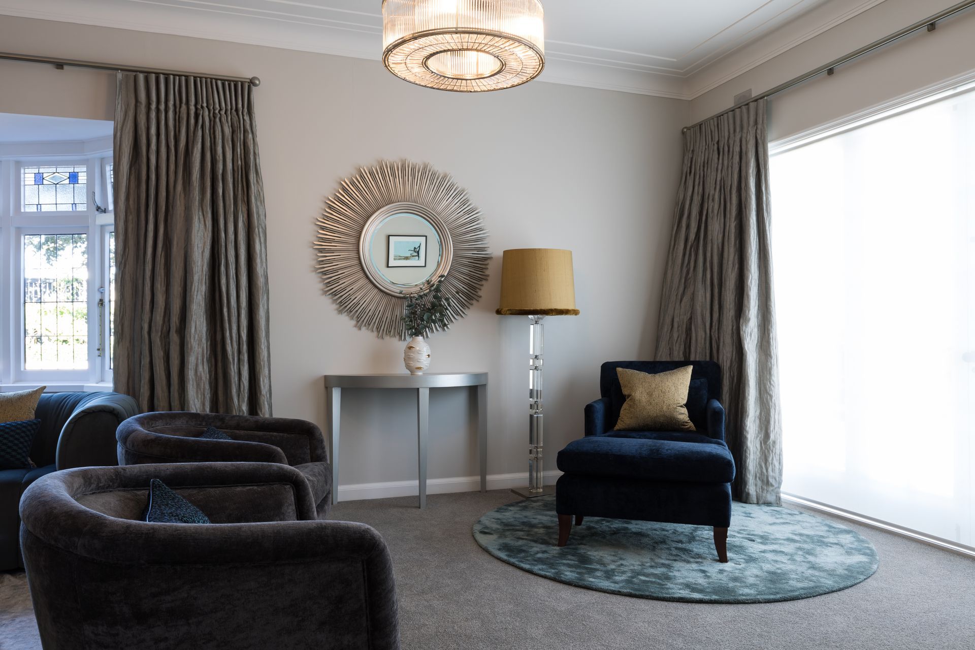 Round teal custom made rug and cusotm designed occassional table