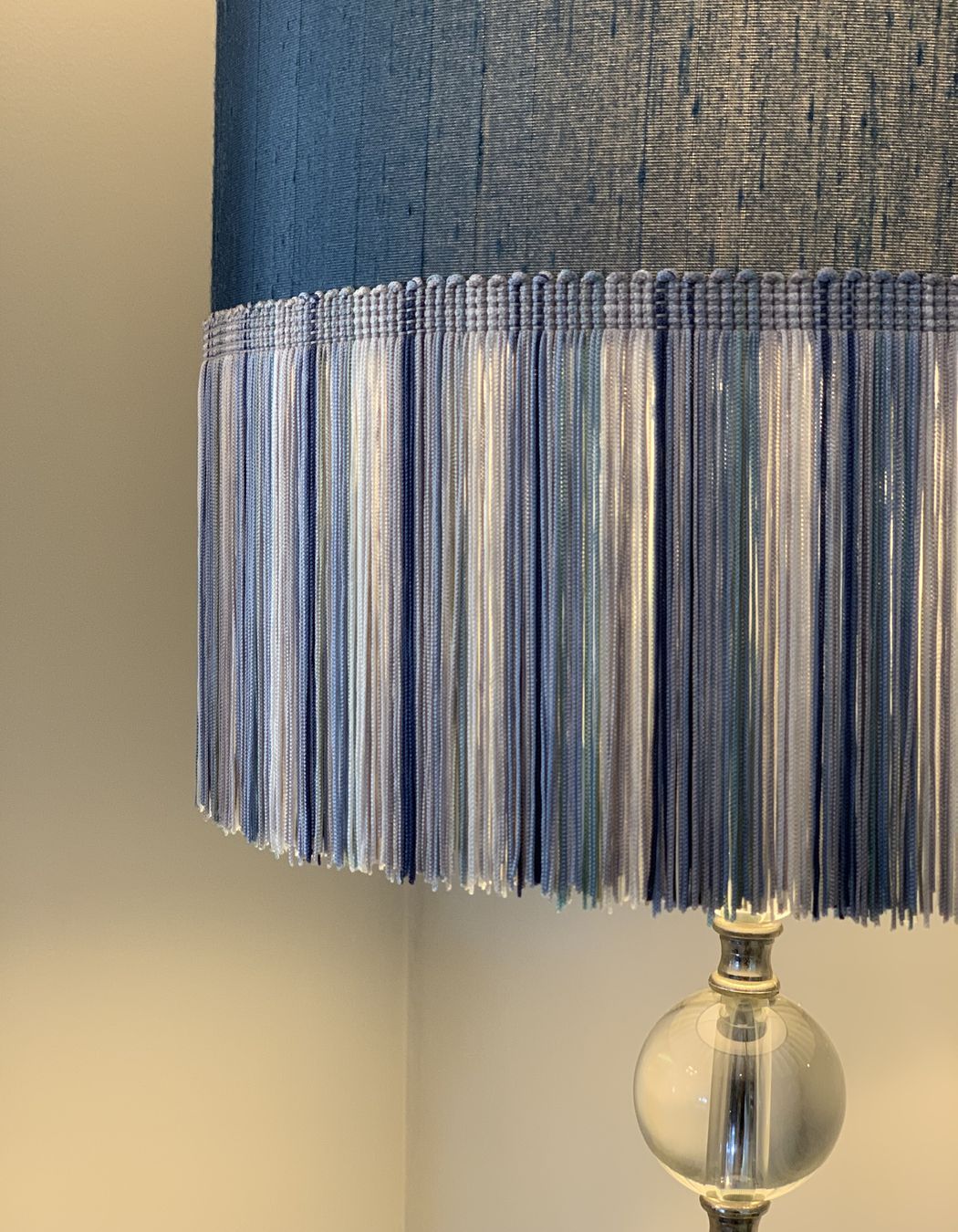 Adding colour and texture - a lamp shade with long fringing in shades of blue