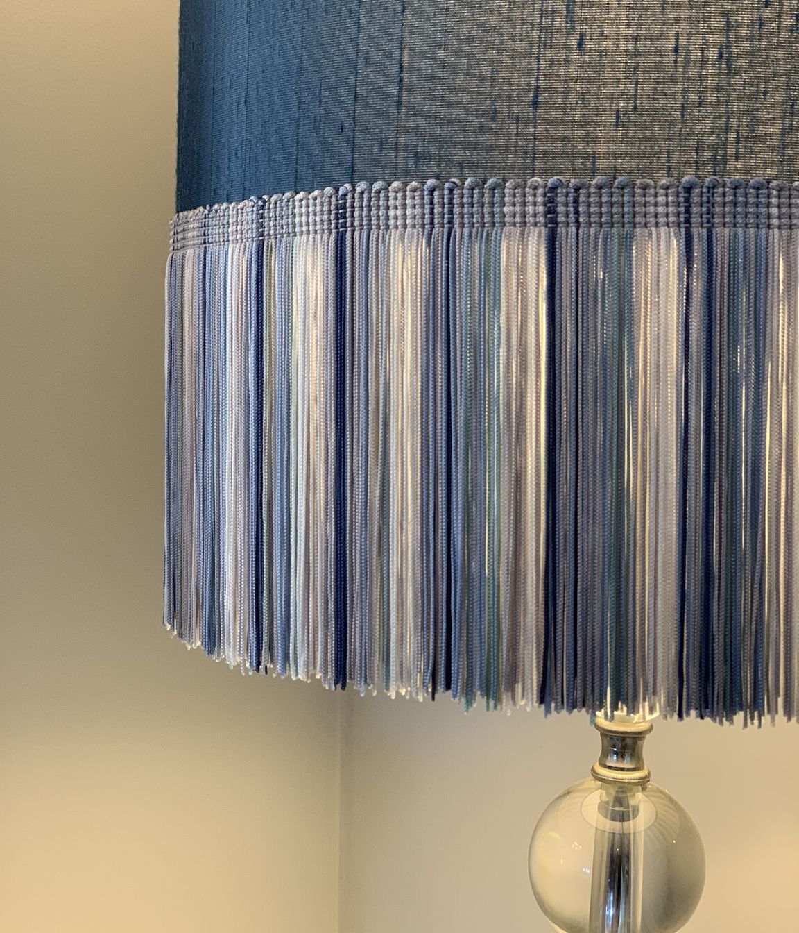 Adding colour and texture - a lamp shade with long fringing in shades of blue
