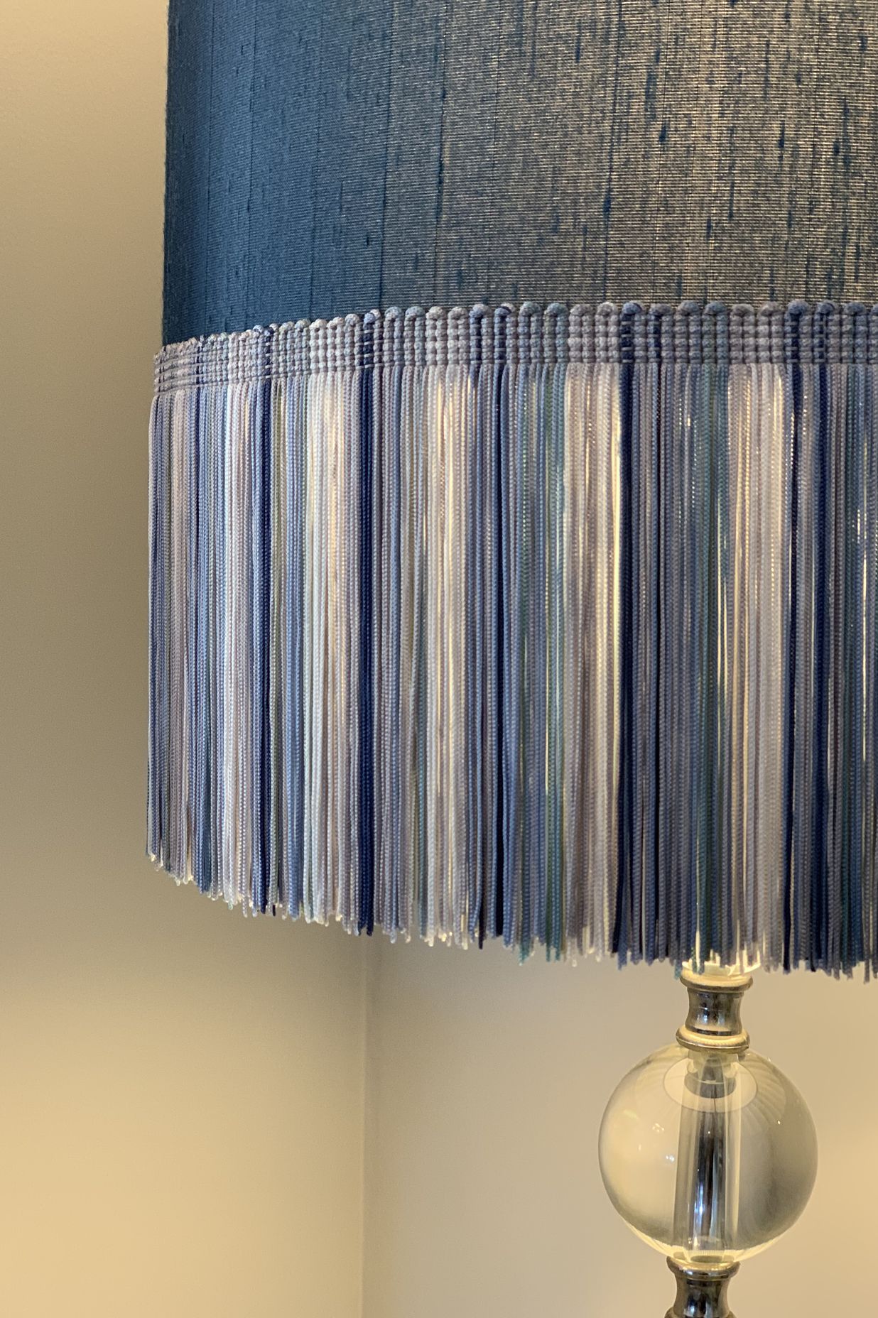 Adding colour and texture - a lamp shade with long fringing in shades of blue