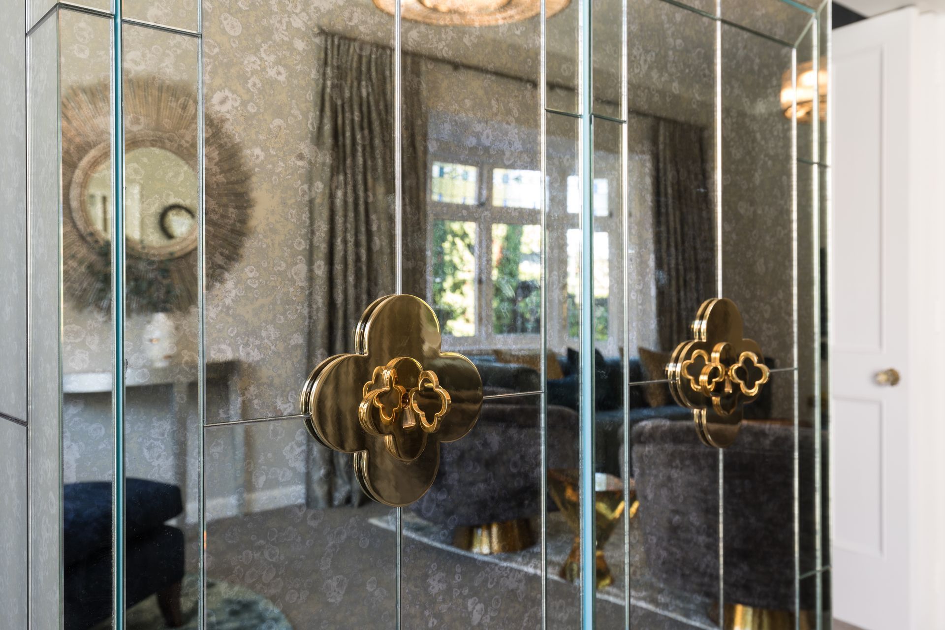 Seeing reflection in the Jonathan Adler drinks cabinet