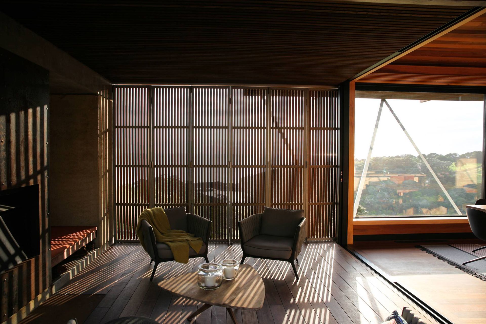 Huge rainscreen concertina doors slide back to reveal the outdoor room to the view. Photograph by Jackie Meiring.