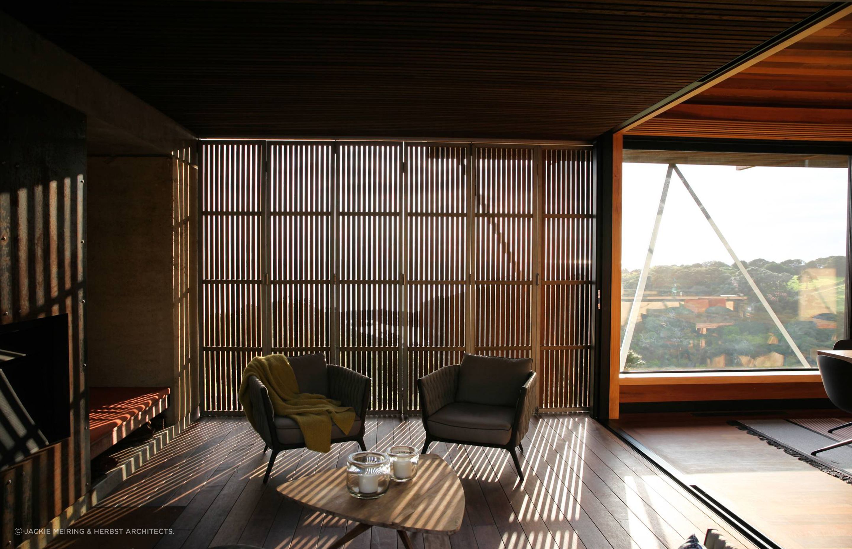 Huge rainscreen concertina doors slide back to reveal the outdoor room to the view. Photograph by Jackie Meiring.