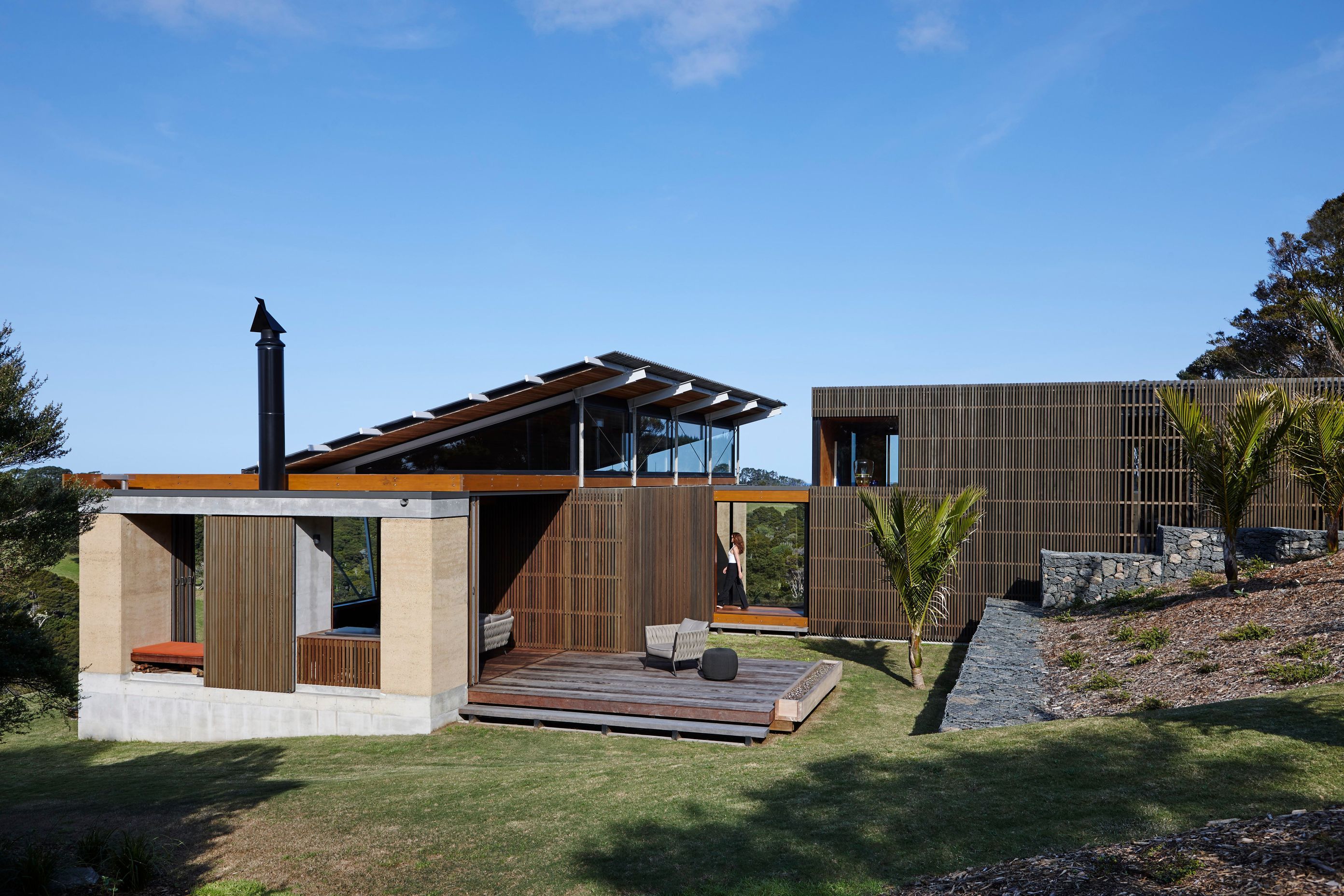 The north-facing elevation shows the pathway leading down to the covered walking and into the home. Photograph by Jackie Meiring.