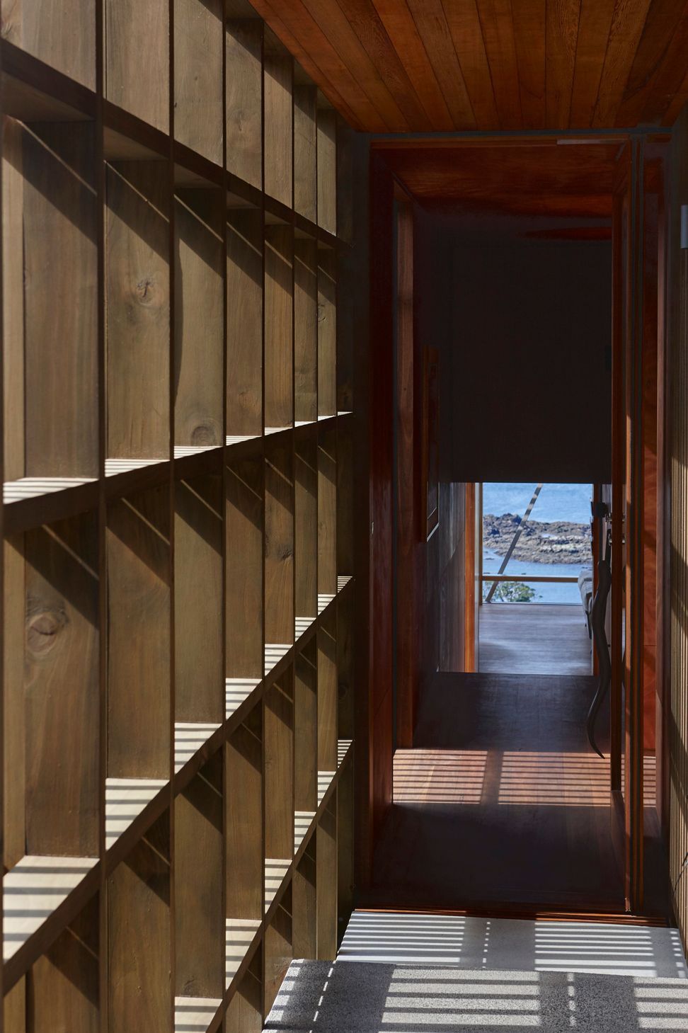 Rainscreens provide protection and daplled light into the covered walkway.