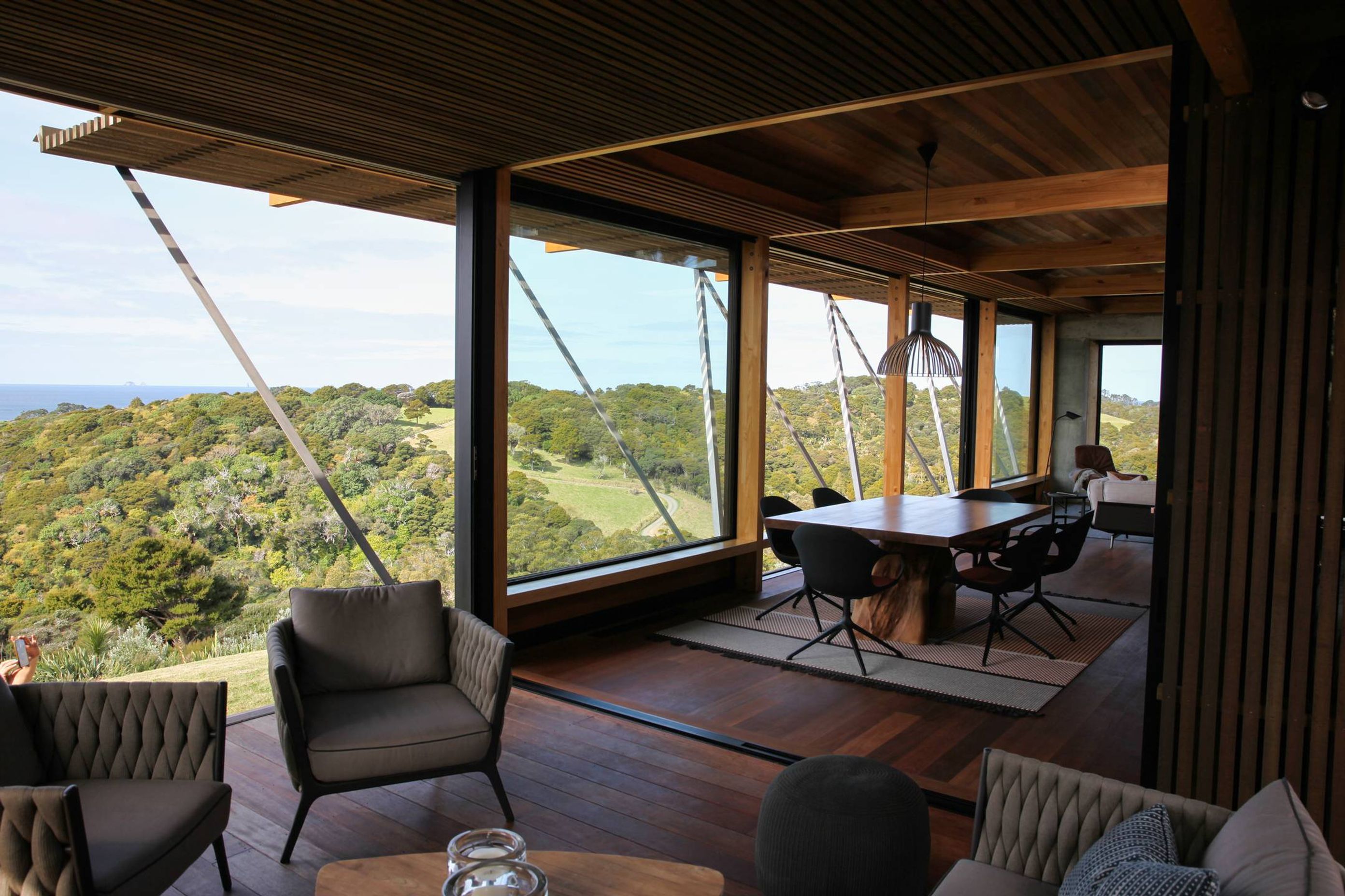 A room with a view to die for – overlooking the treetops and the ocean to Poor Knights Islands. Photograph by Jackie Meiring.