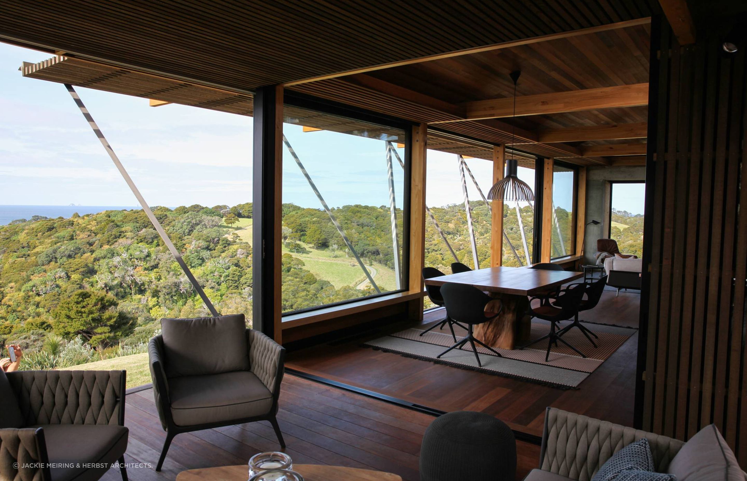 A room with a view to die for – overlooking the treetops and the ocean to Poor Knights Islands. Photograph by Jackie Meiring.