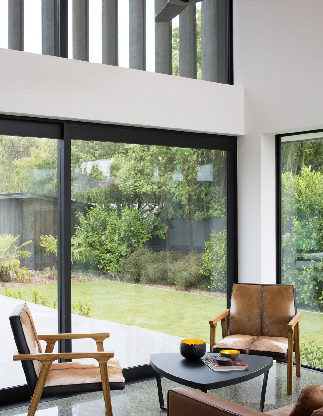 Landscaping has been cleverly designed to screen off the front property and to provide a verdant view from every room.