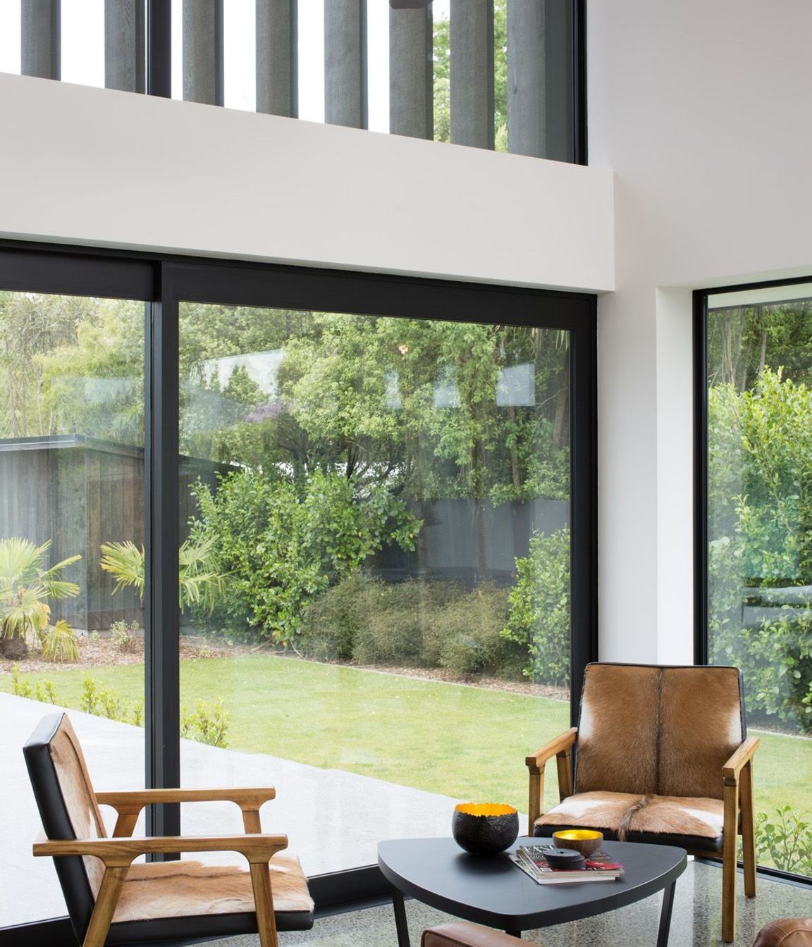 Landscaping has been cleverly designed to screen off the front property and to provide a verdant view from every room.