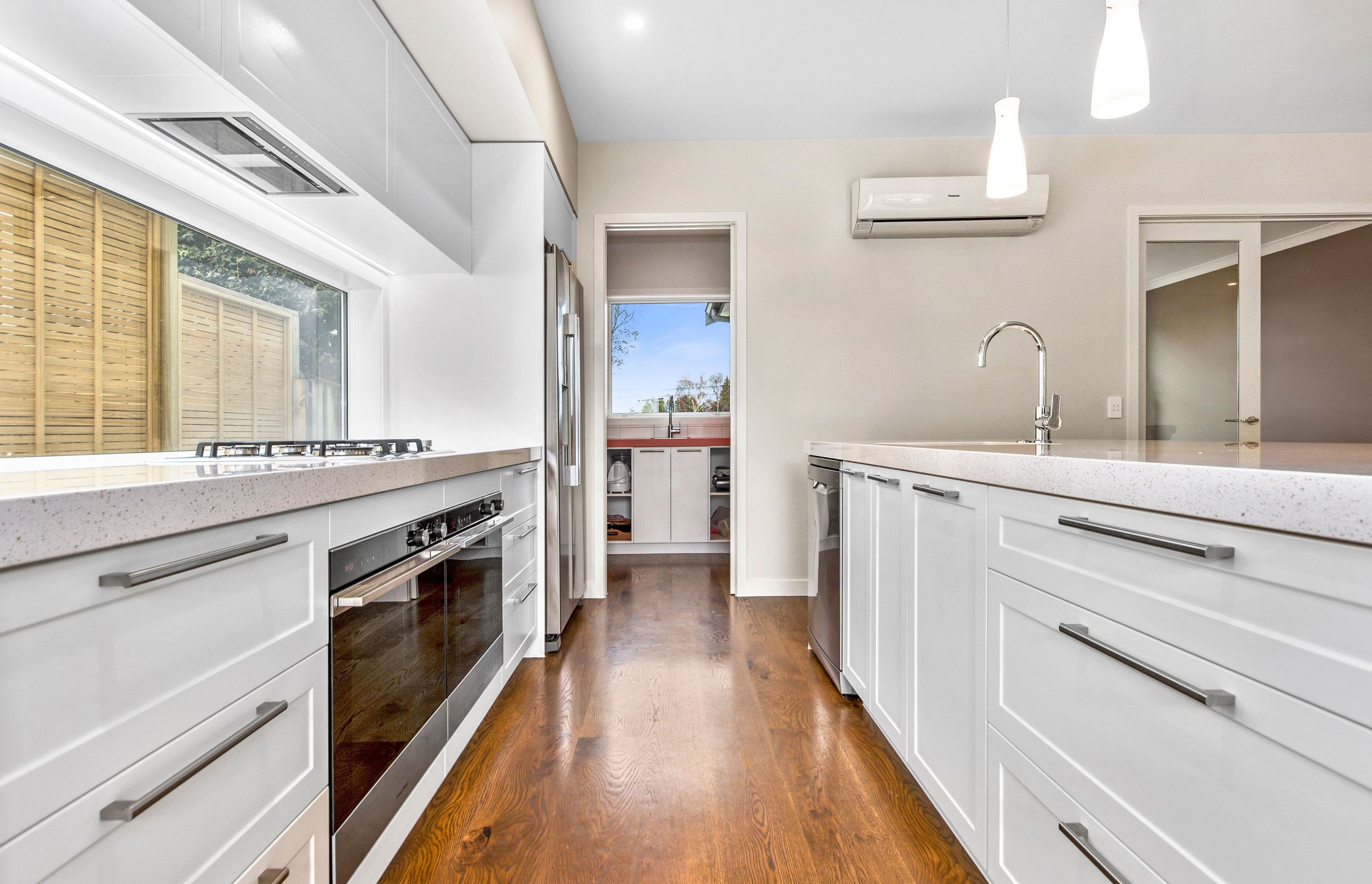 A kitchen designed for entertaining with ceasar stone bench tops.