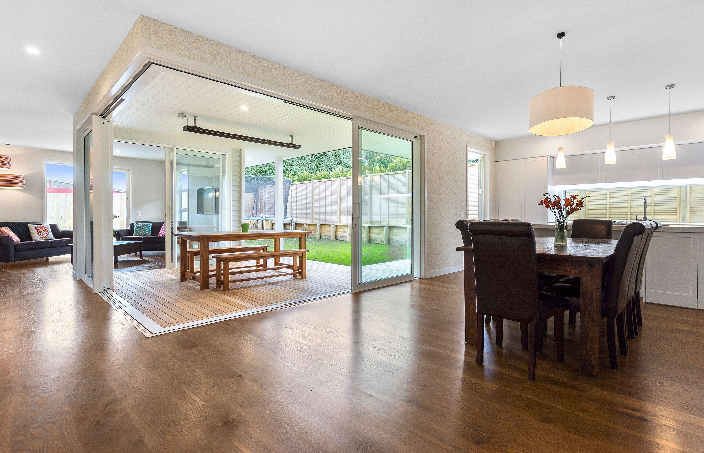 Rustic oak flooring flowing to outdoor decking area. 