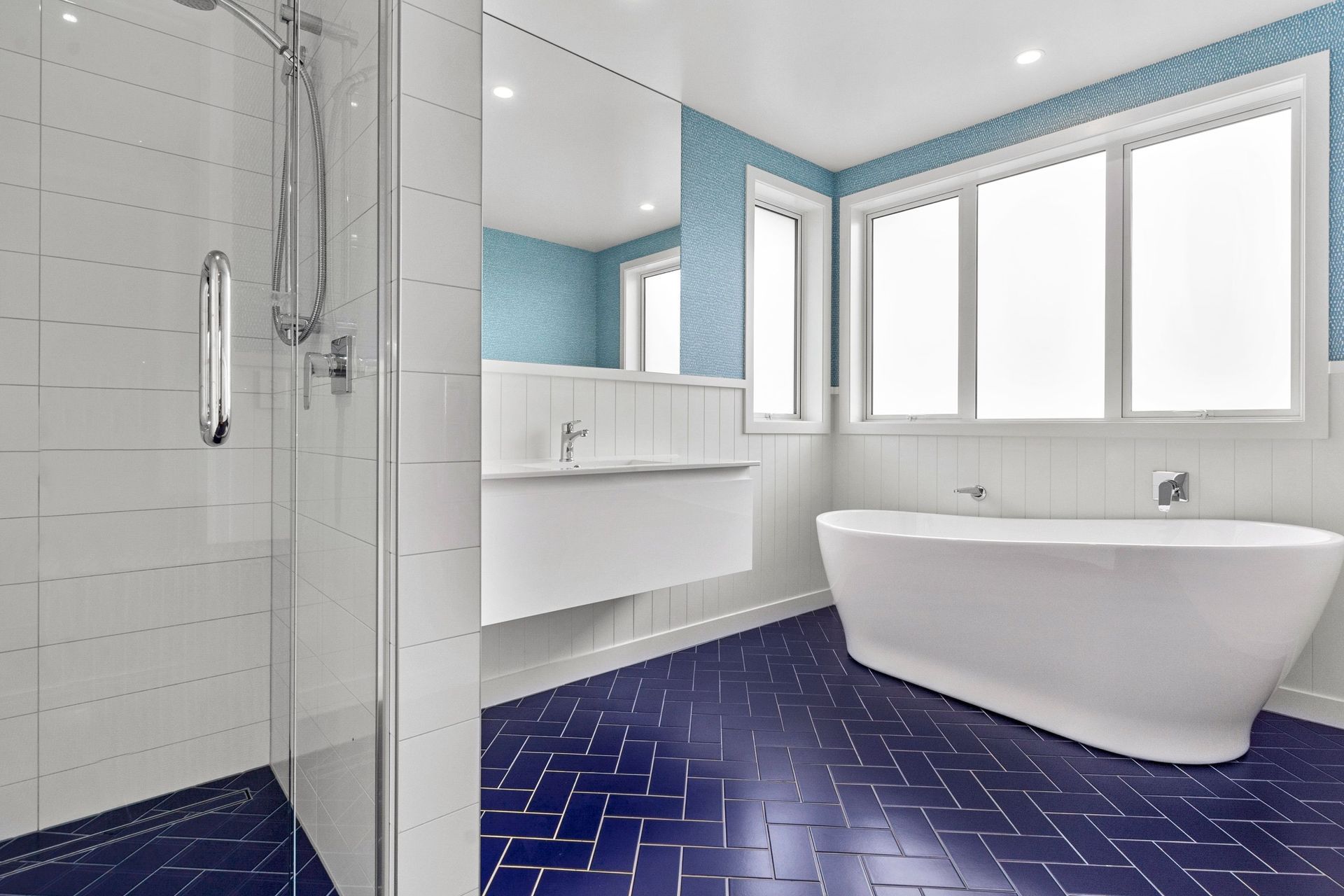 White and blue suits this modern bathroom down to the ground.