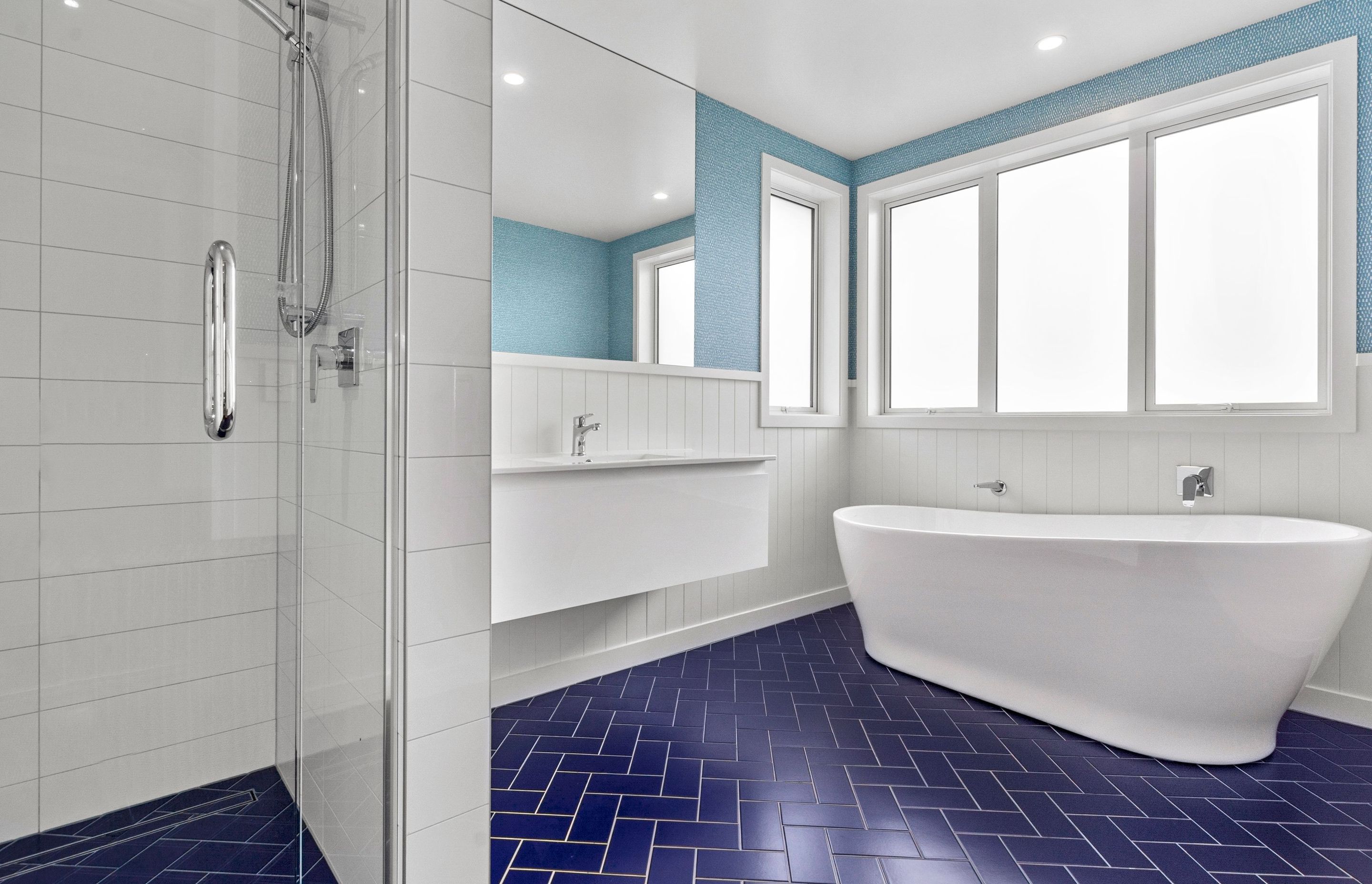 White and blue suits this modern bathroom down to the ground.