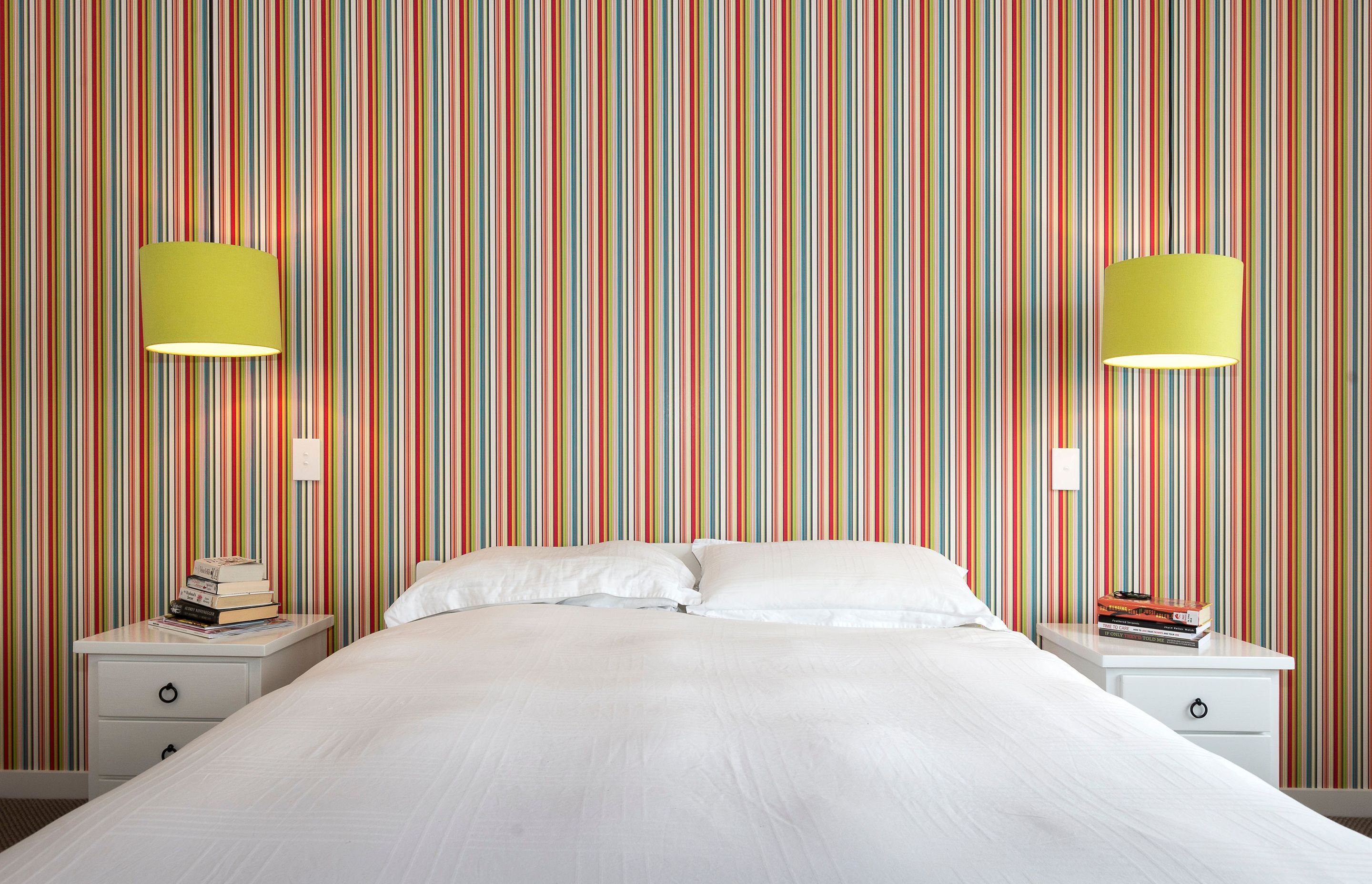 Full of vibrant colour this home has feature wall papers, hardy groove wall panelling, herring bone tiling and rustic solid oak flooring.