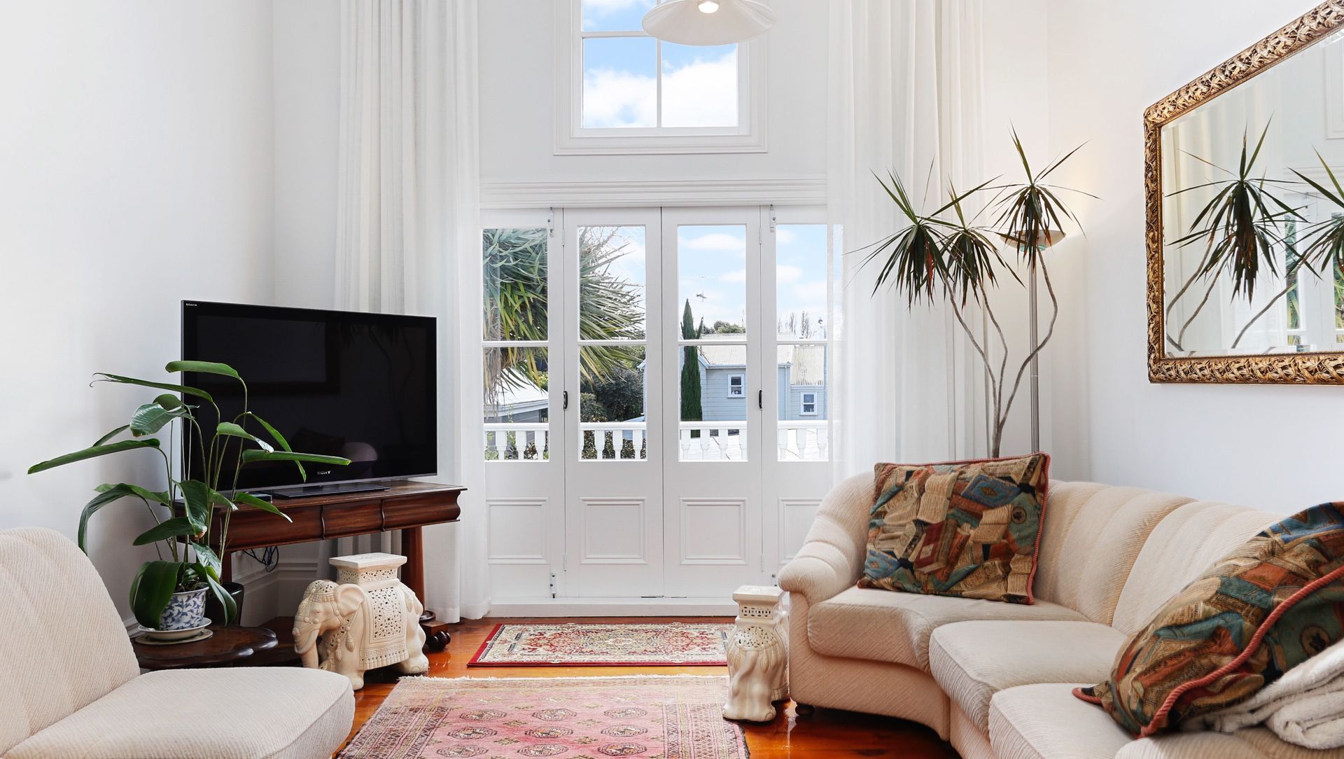 Check out those incredible high ceilings! Final touches done in the living area. 
