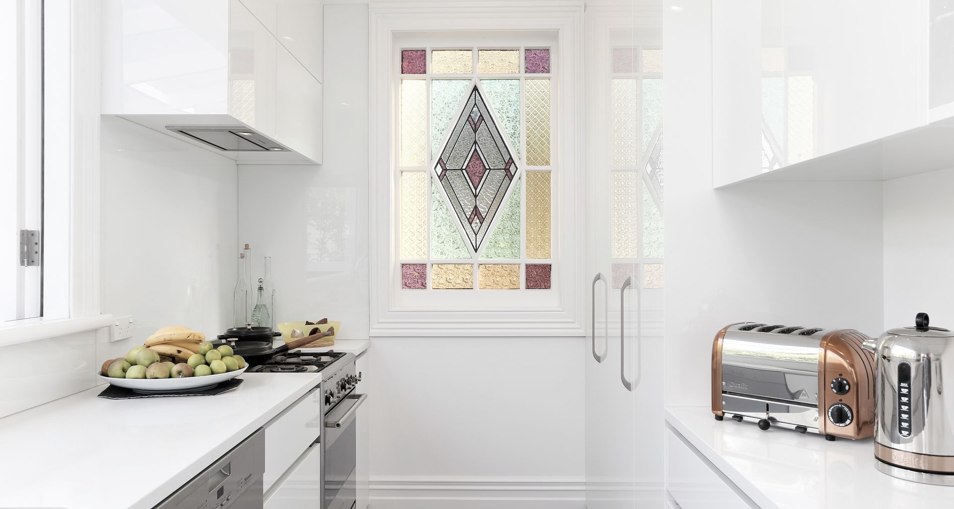 We reused this stunning stained glass window by cutting down and framing an old external LED light door. 