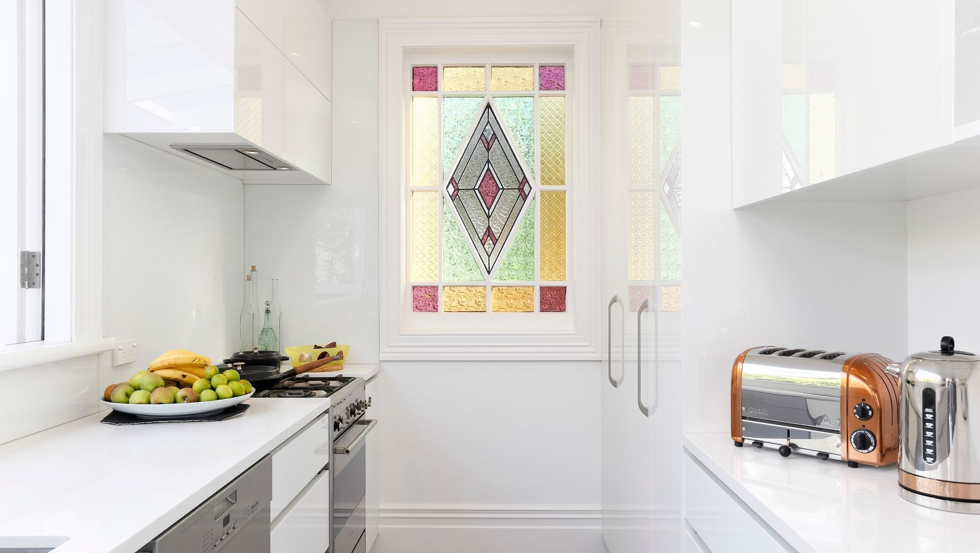 We reused this stunning stained glass window by cutting down and framing an old external LED light door. 