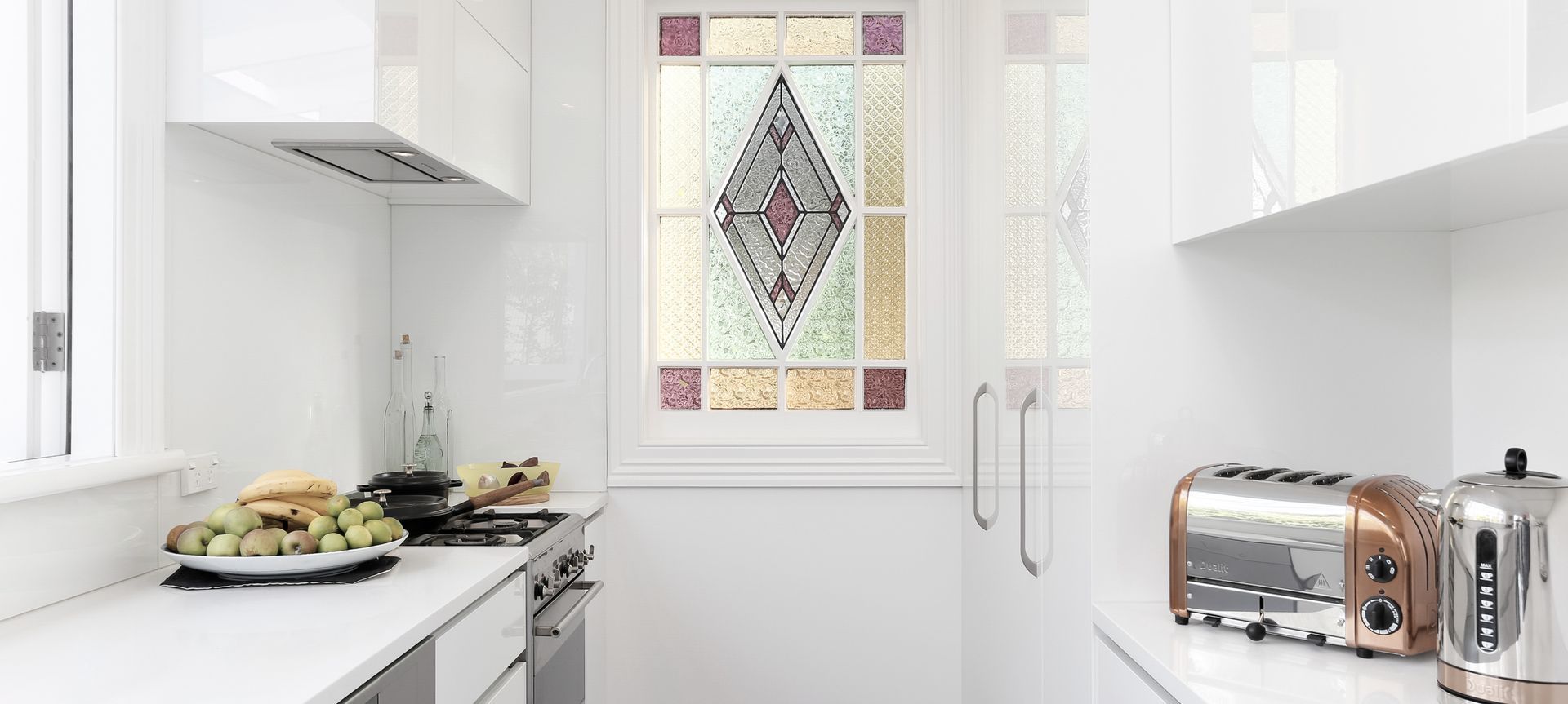 We reused this stunning stained glass window by cutting down and framing an old external LED light door. 