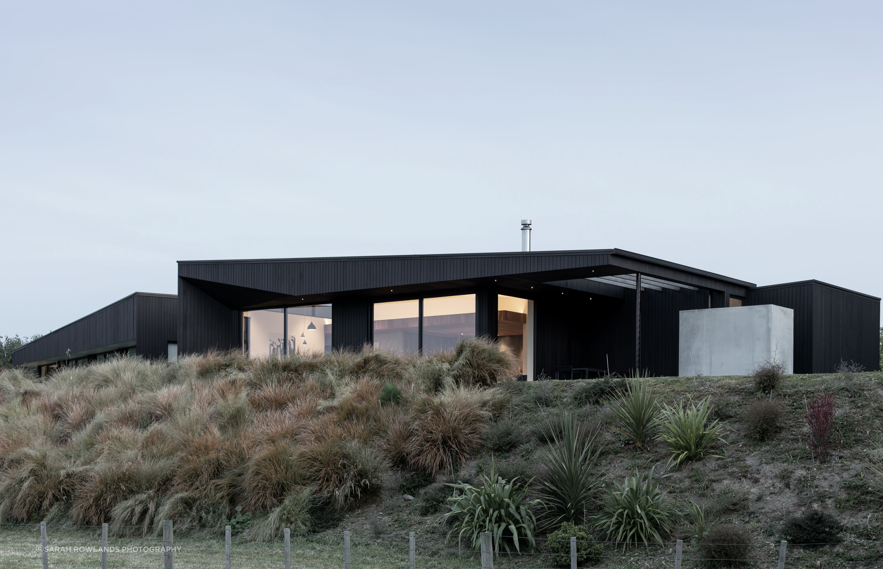 Sited within an existing vineyard, this contemporary new home comprises a riven sculptural element set low within the landscape.
