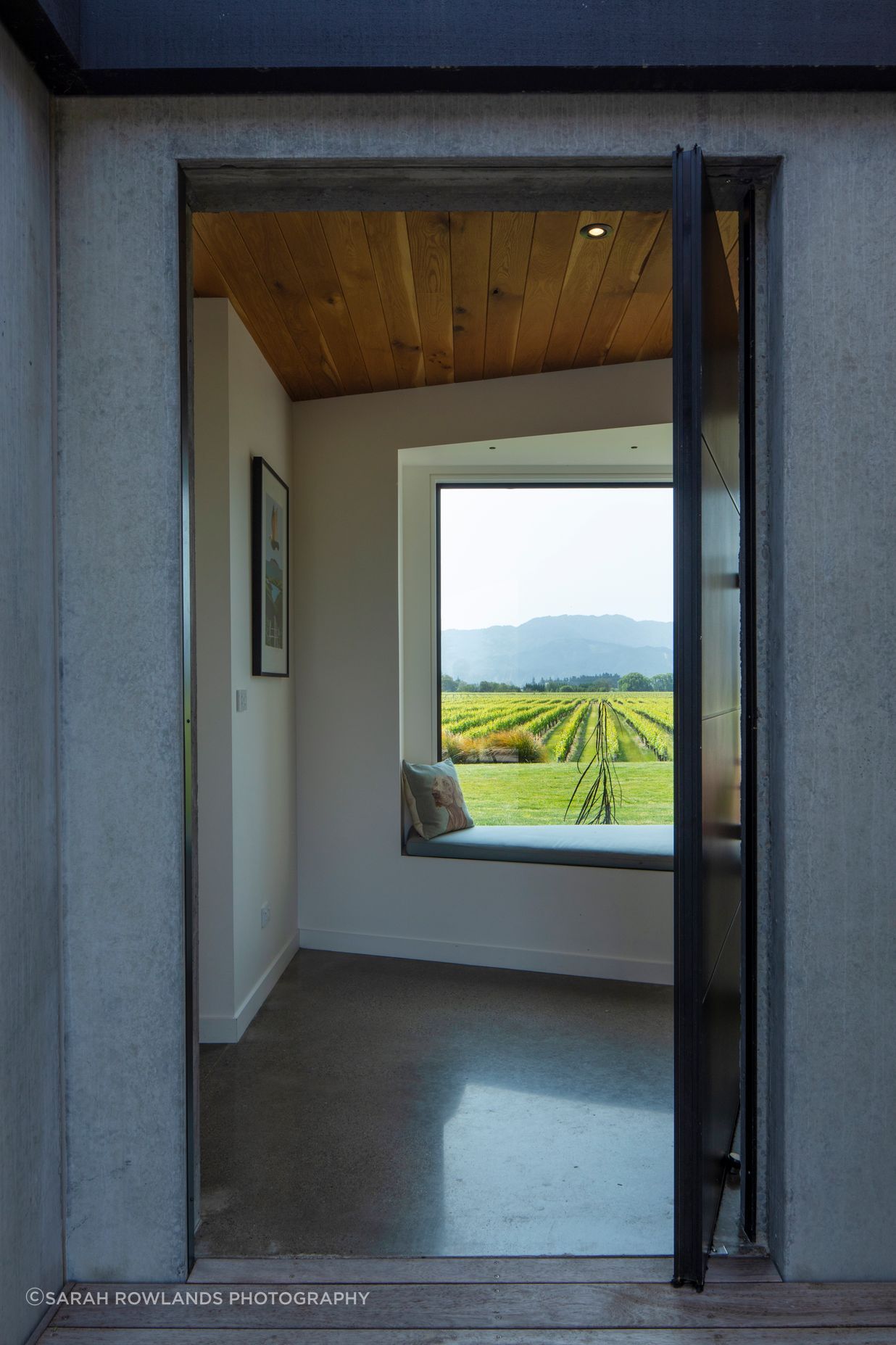A large picture window and window seat greet visitors; hinting at the expansive views to be had.