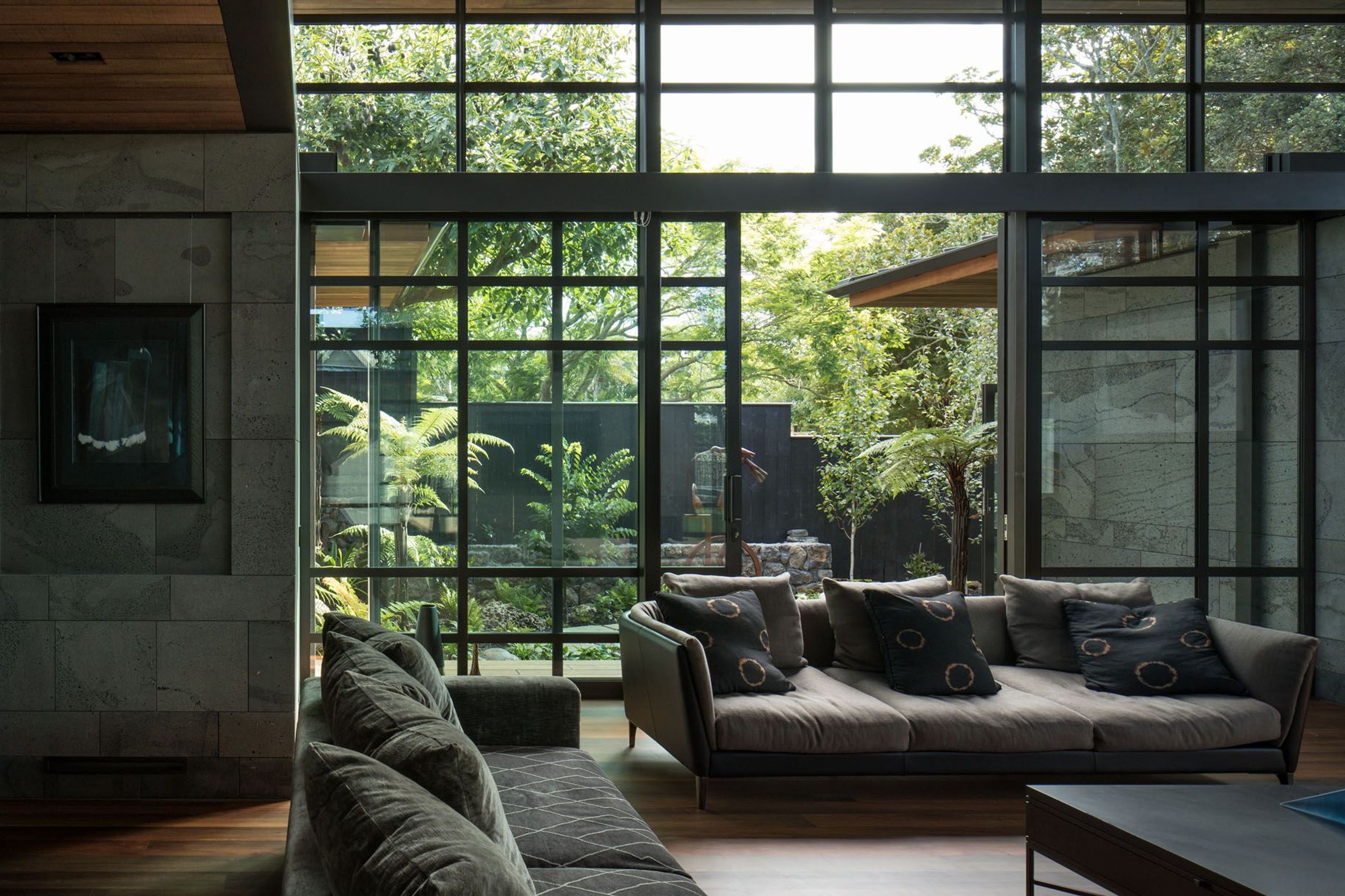 To the rear of the living area is a micro-landscape of mainly native planting and sculptures.