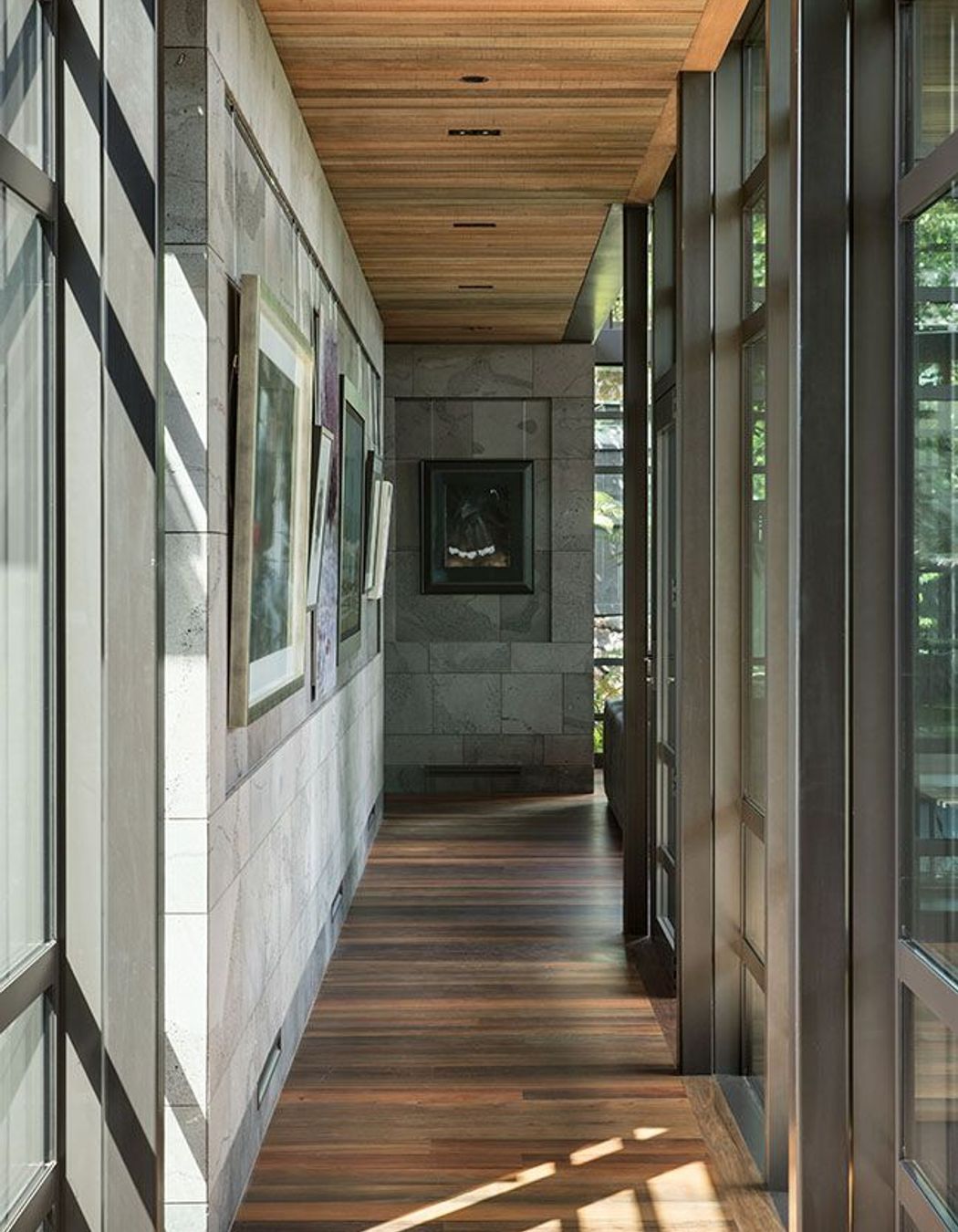 The garage entry forms a bridge that represents ‘a spatial threshold’ into the building.