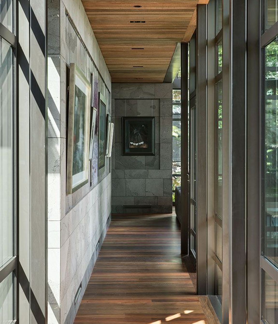 The garage entry forms a bridge that represents ‘a spatial threshold’ into the building.