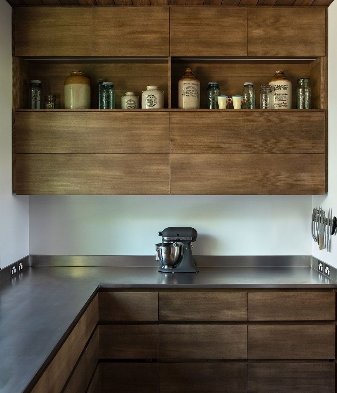 The scullery features plenty of bench space and bespoke built-in cabinetry.