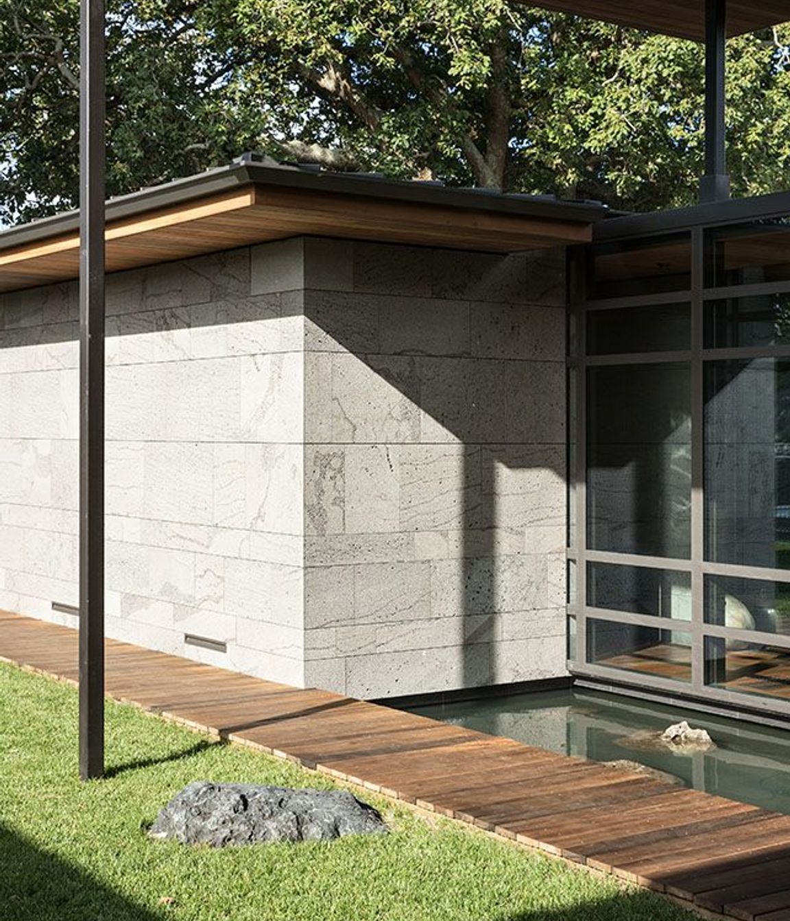 Inspired by Japanese architecture, reflection ponds and strategically placed stones create features in the micro-landscapes that surround Volcano House.