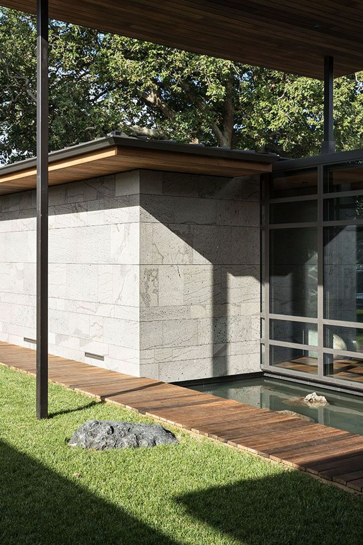 Inspired by Japanese architecture, reflection ponds and strategically placed stones create features in the micro-landscapes that surround Volcano House.