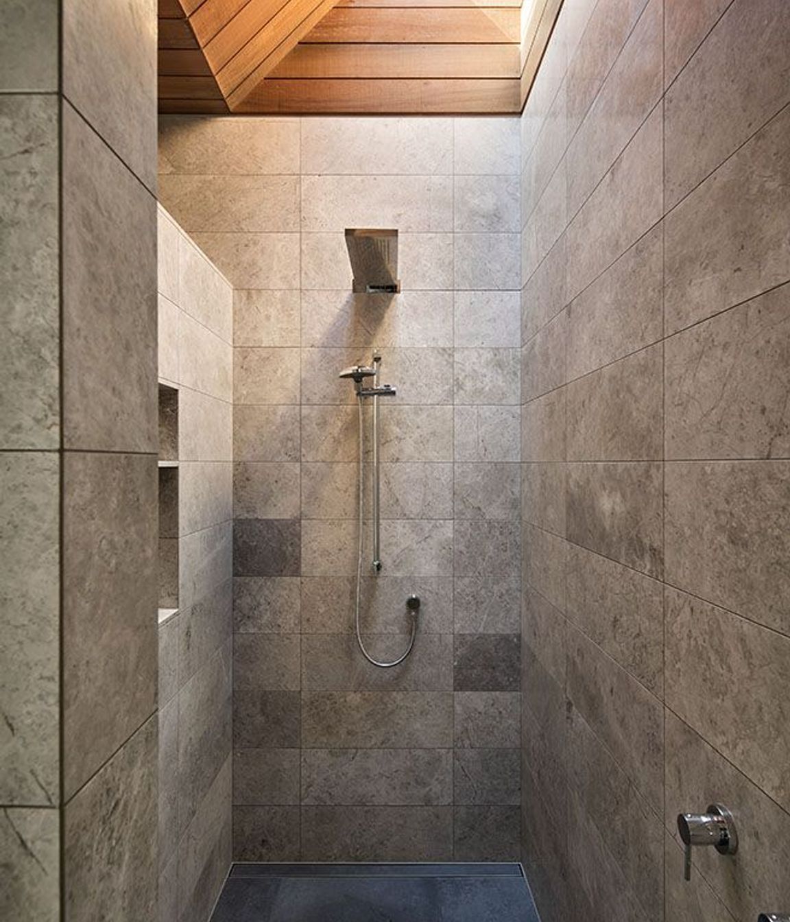 This shower features a skylight to draw in light from above.