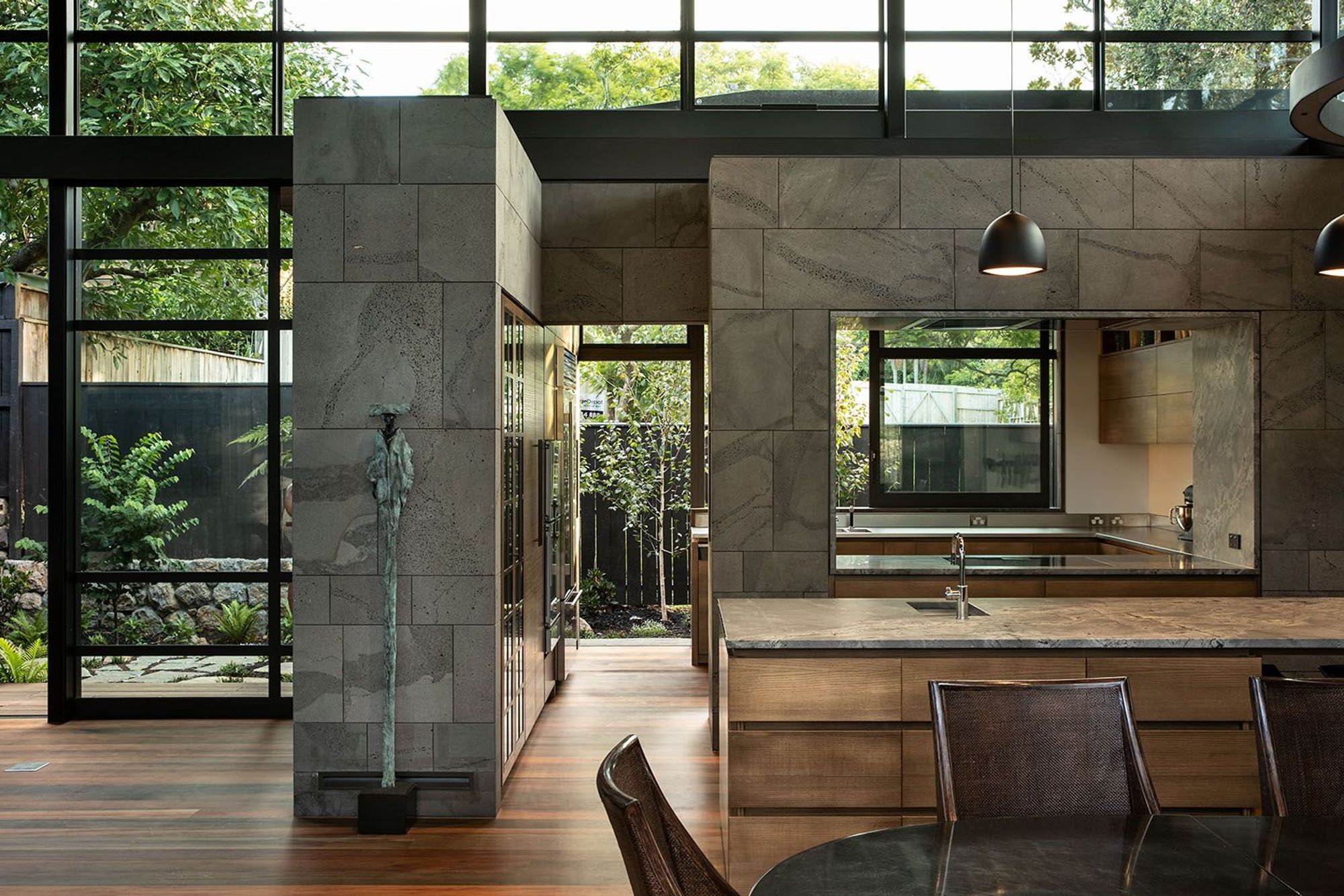 The kitchen leads out to a kitchen garden and features an 'open' scullery in behind the main kitchen island. High clerestory windows help to draw light into the deeper interior spaces.