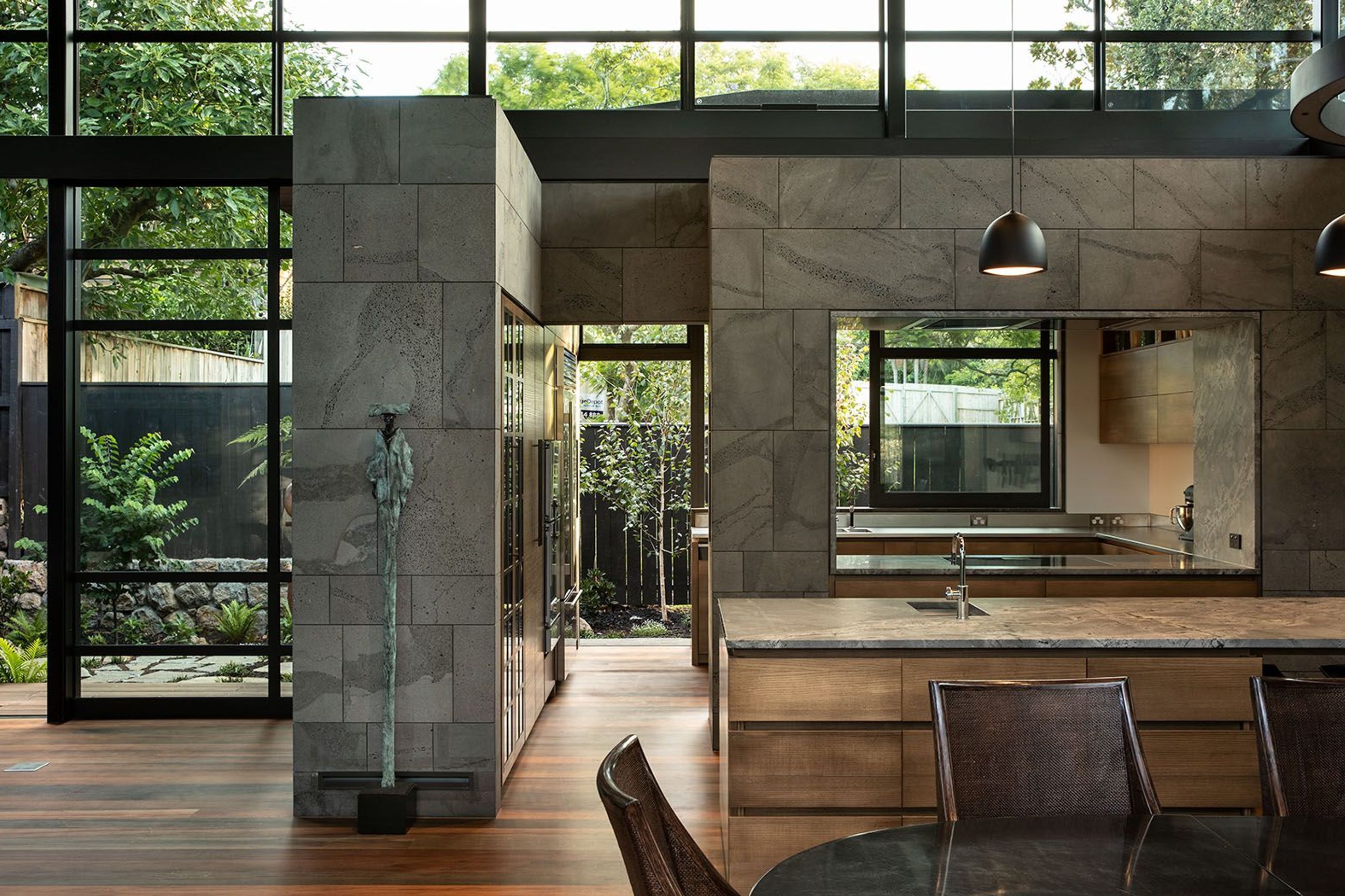The kitchen leads out to a kitchen garden and features an 'open' scullery in behind the main kitchen island. High clerestory windows help to draw light into the deeper interior spaces.