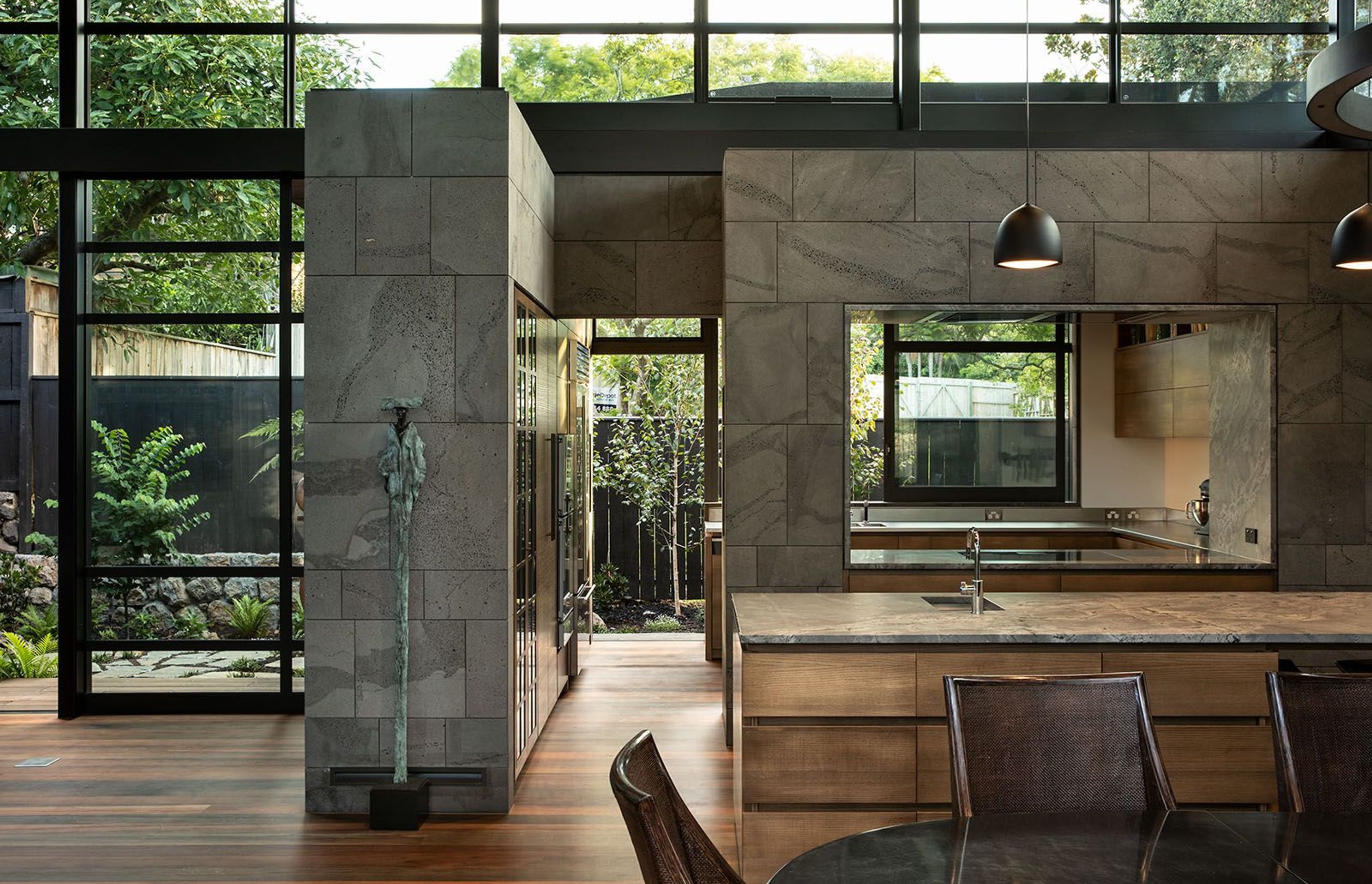 The kitchen leads out to a kitchen garden and features an 'open' scullery in behind the main kitchen island. High clerestory windows help to draw light into the deeper interior spaces.