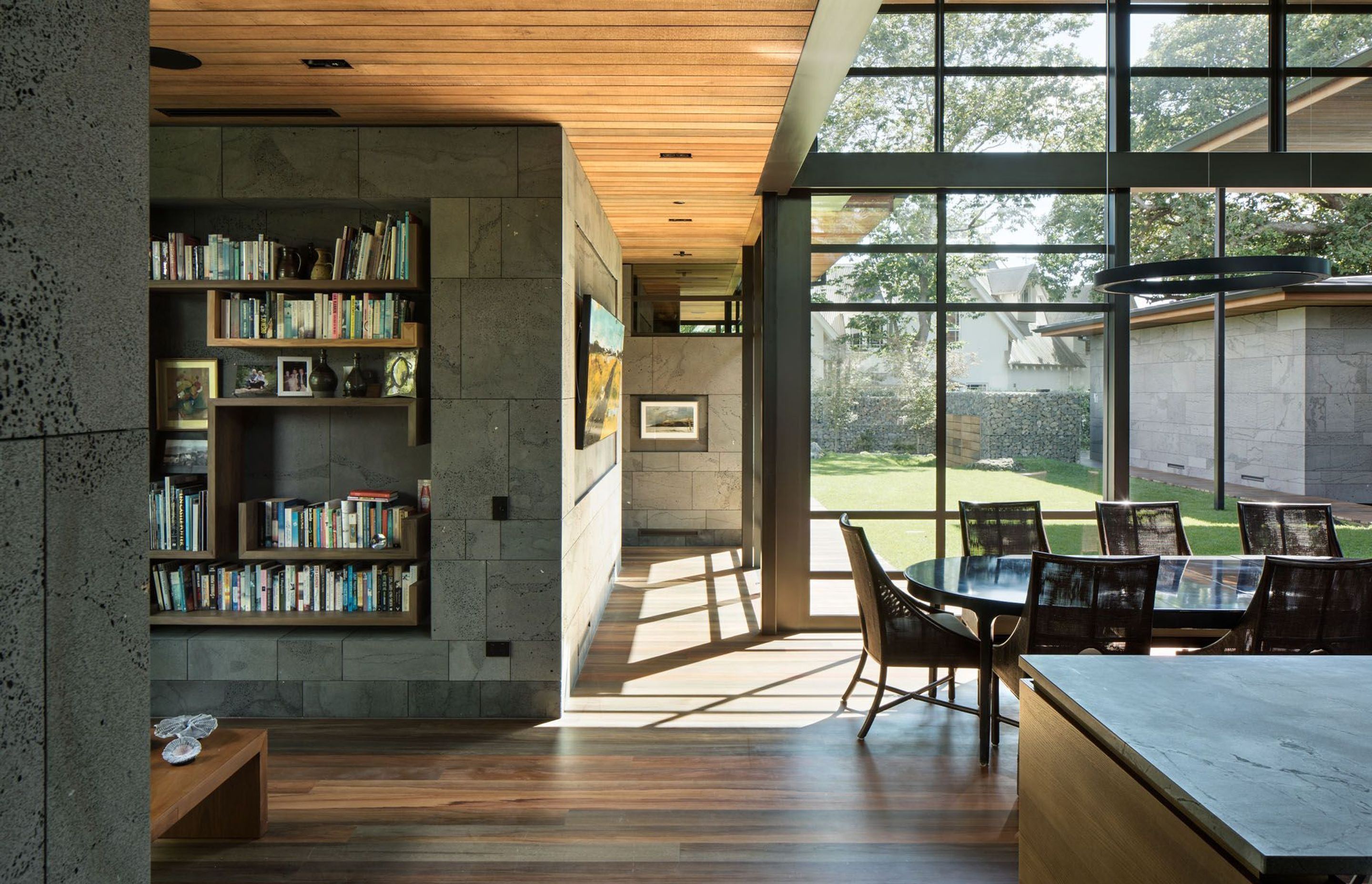 The corridor to the master bedroom overlooks the main central courtyard. Durable aluminium joinery is a perfect solution in this coastal environment.