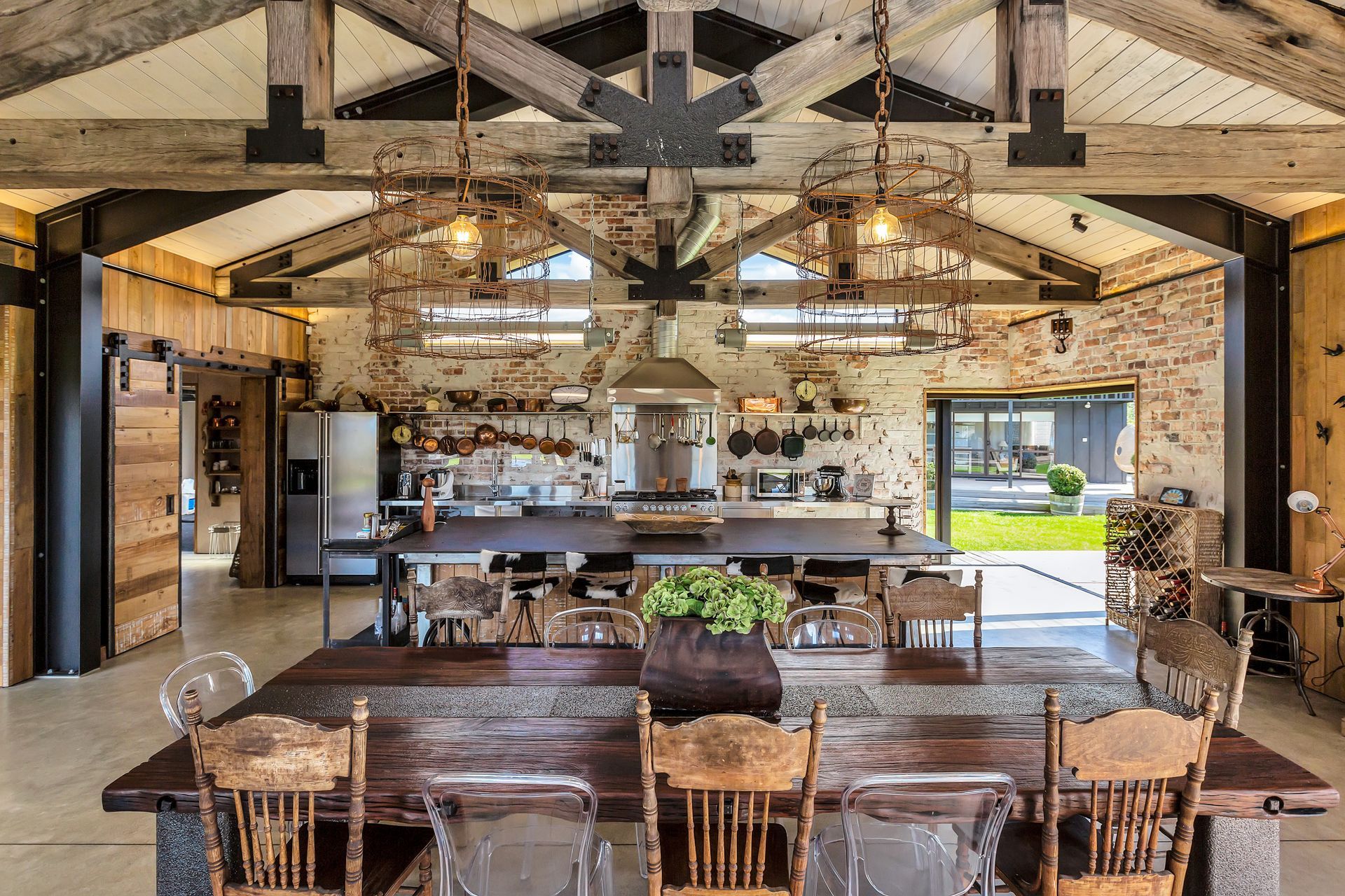 Pendant lights in the kitchen/dining area are from barbed wire once used to fence former All Black Robbie Deans' sheep station. The vintage fluorescent lamps are from East Germany.