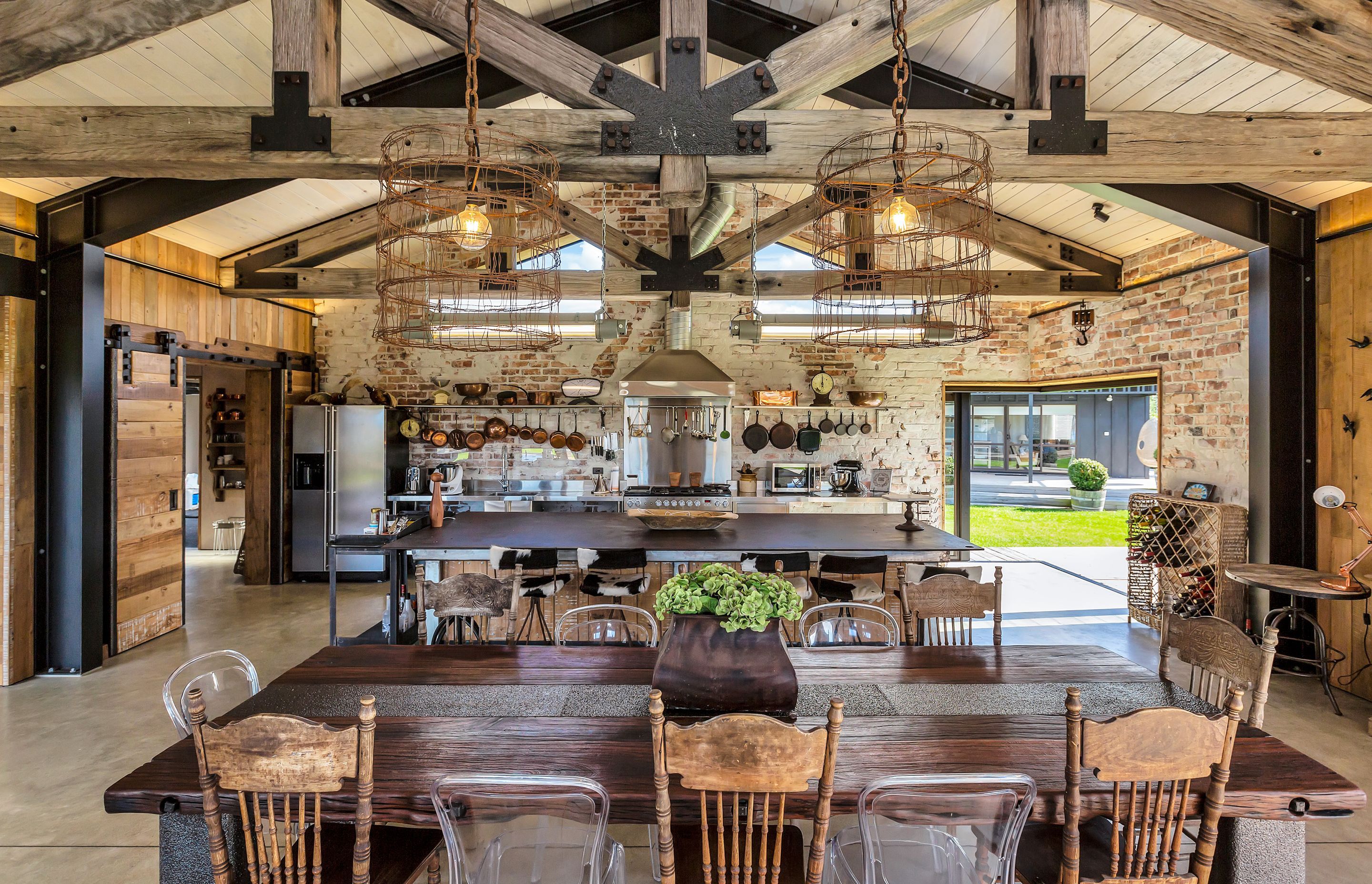 Pendant lights in the kitchen/dining area are from barbed wire once used to fence former All Black Robbie Deans' sheep station. The vintage fluorescent lamps are from East Germany.