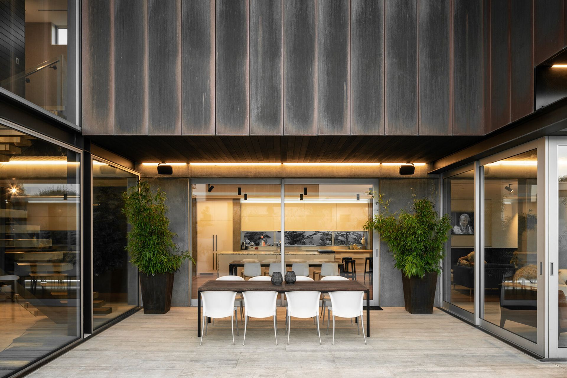 To the side of the home, beneath the copper form is a courtyard, from the prevailing southerly and easterly winds.