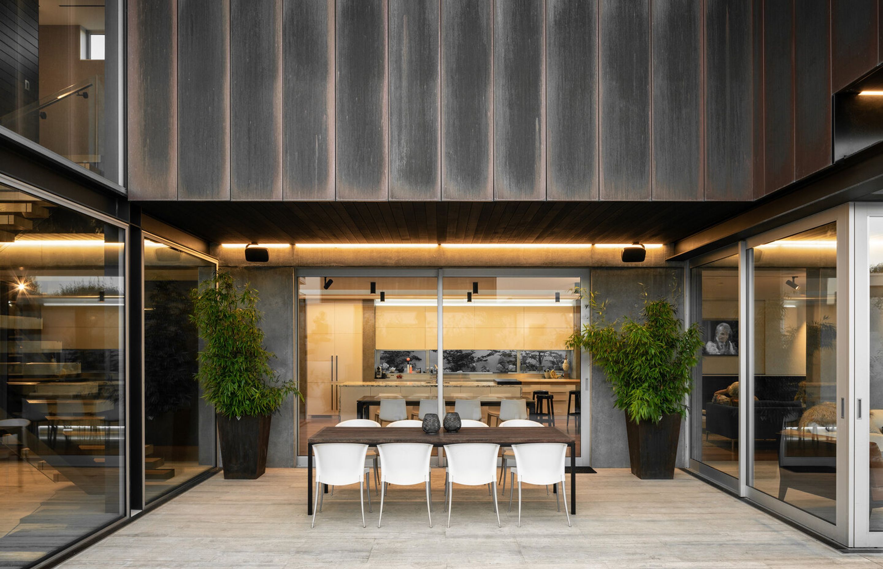 To the side of the home, beneath the copper form is a courtyard, from the prevailing southerly and easterly winds.