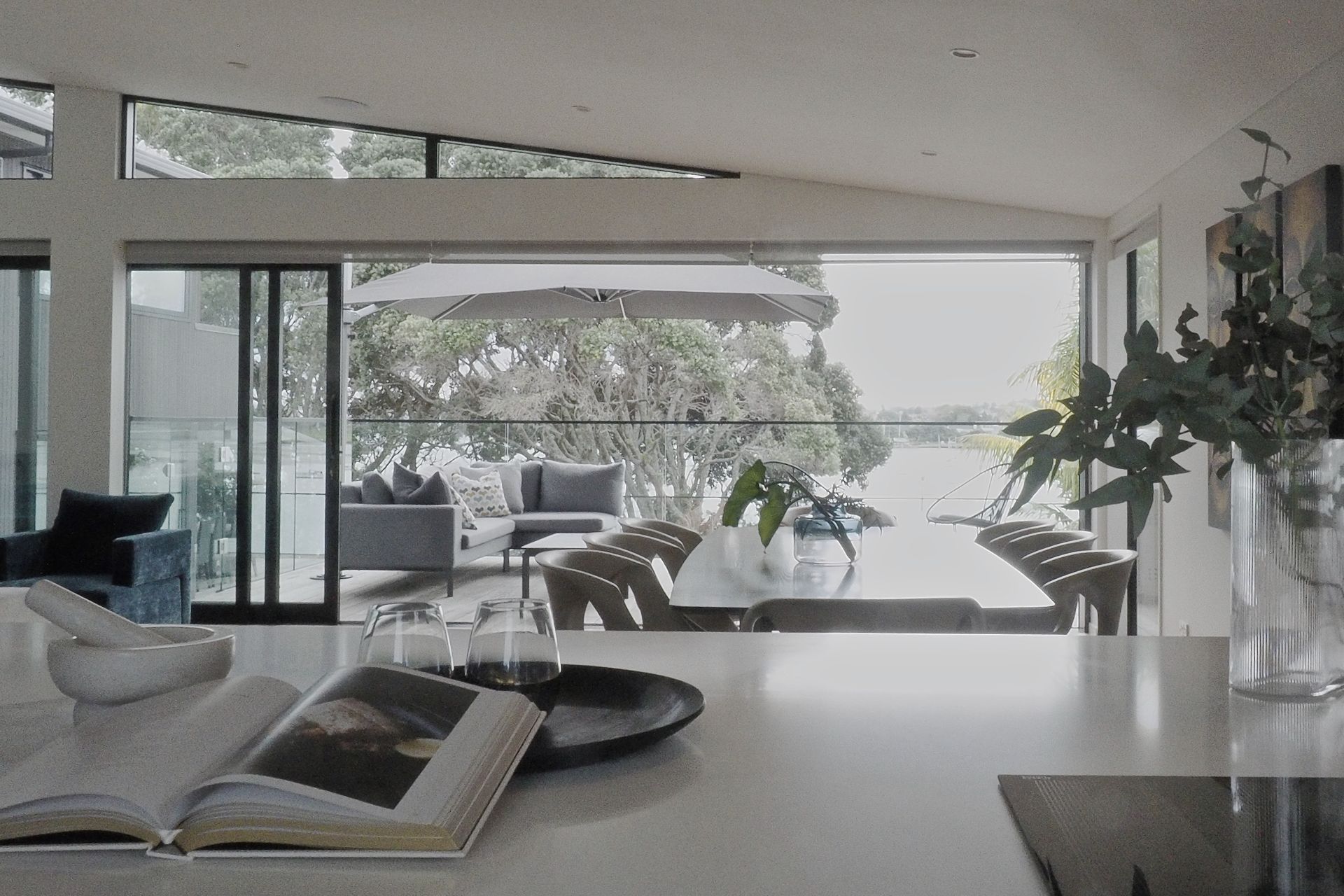 A cooks view through the trees to the harbour.