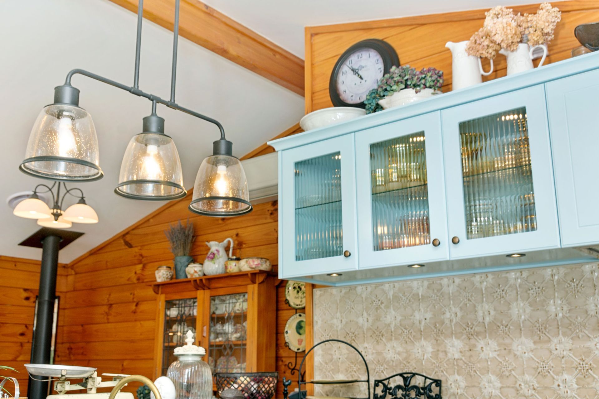 reeded glass insert in cupobard doors adds interest to the contents