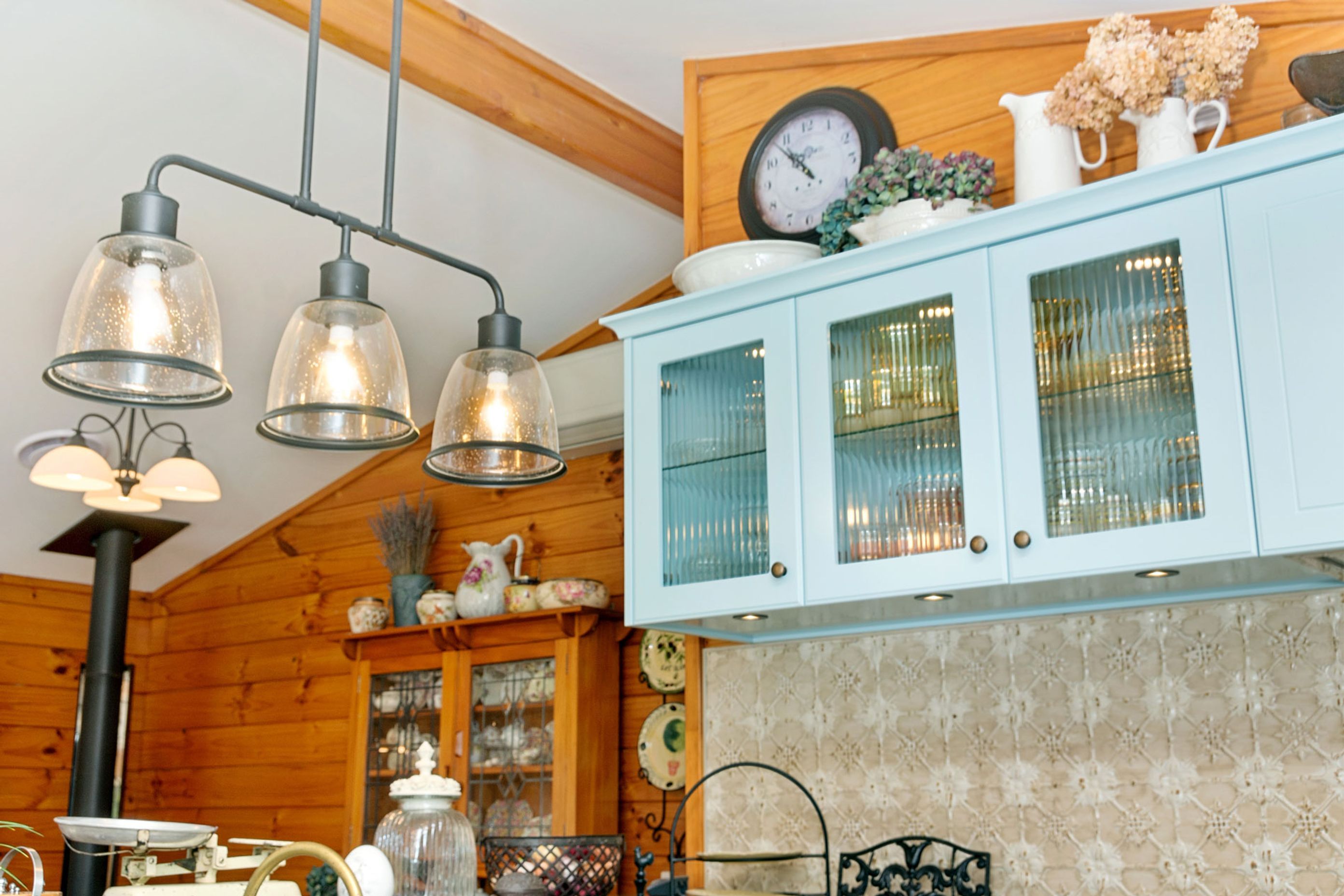 reeded glass insert in cupobard doors adds interest to the contents