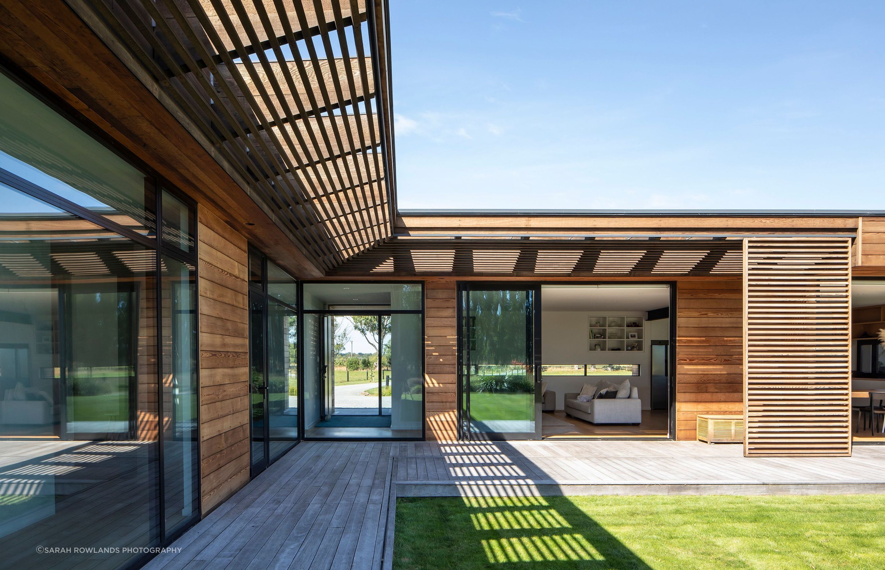 The verandah flows along the north–north-west facing edges of the house, providing areas of shade from the sun.