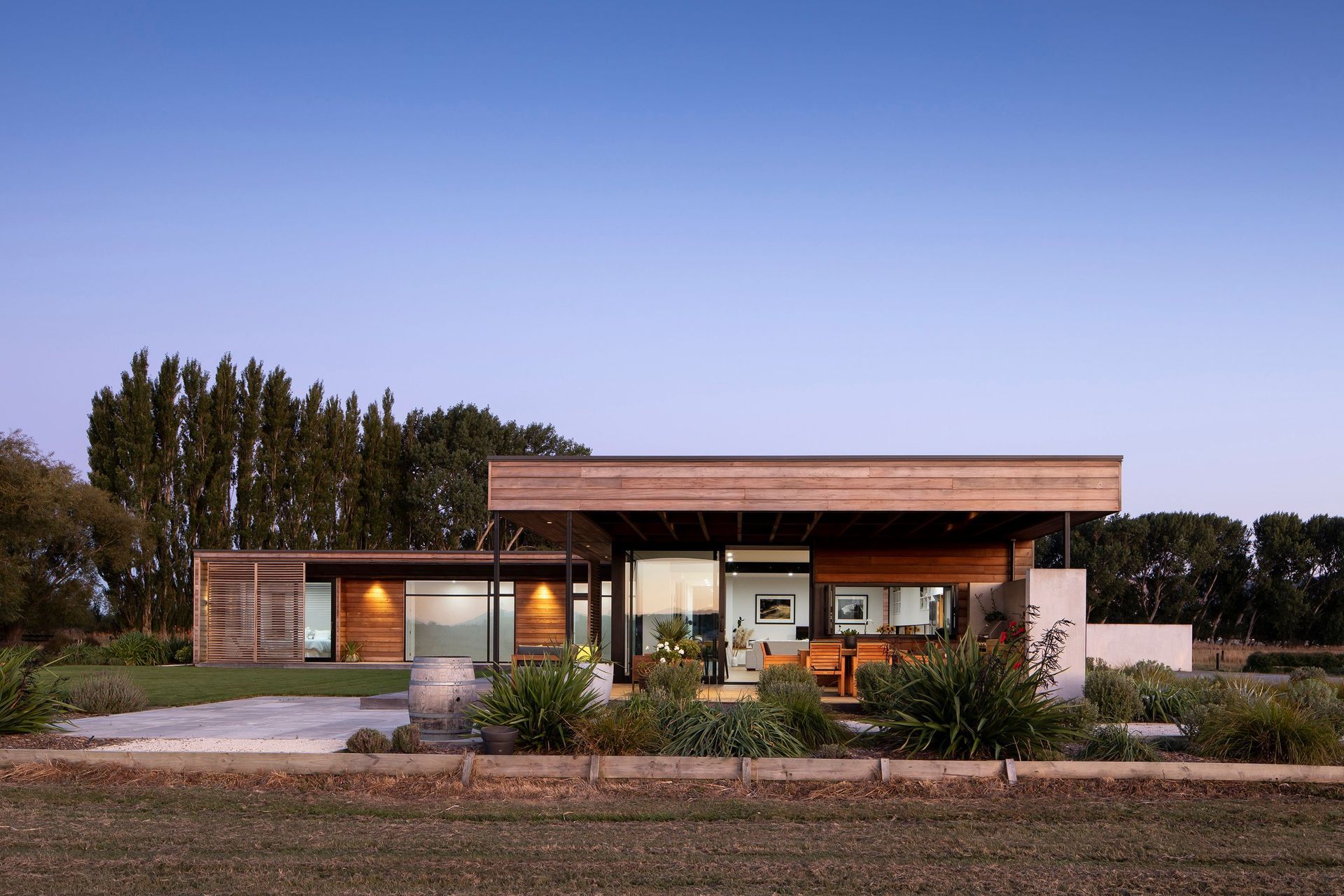 On a lifestyle property on the outskirts of Christchurch, Wings House is a low-slung L-shaped pavilion form designed for functional family living.