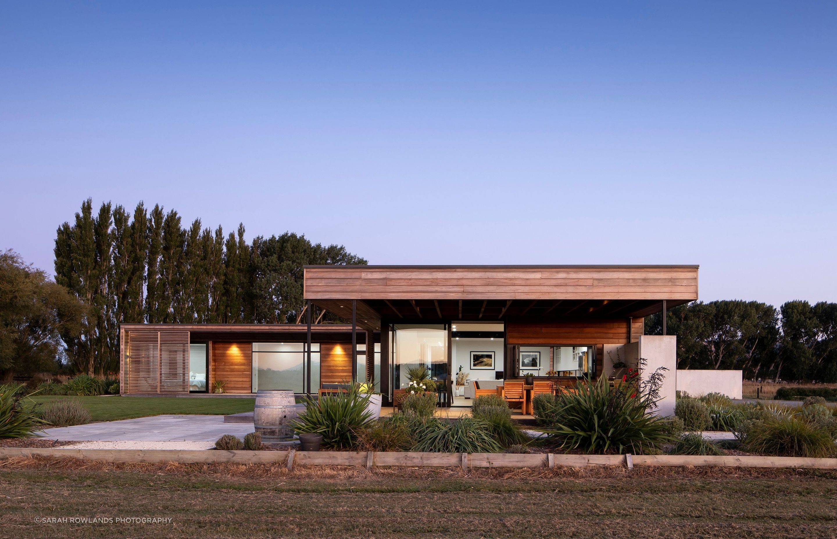 On a lifestyle property on the outskirts of Christchurch, Wings House is a low-slung L-shaped pavilion form designed for functional family living.