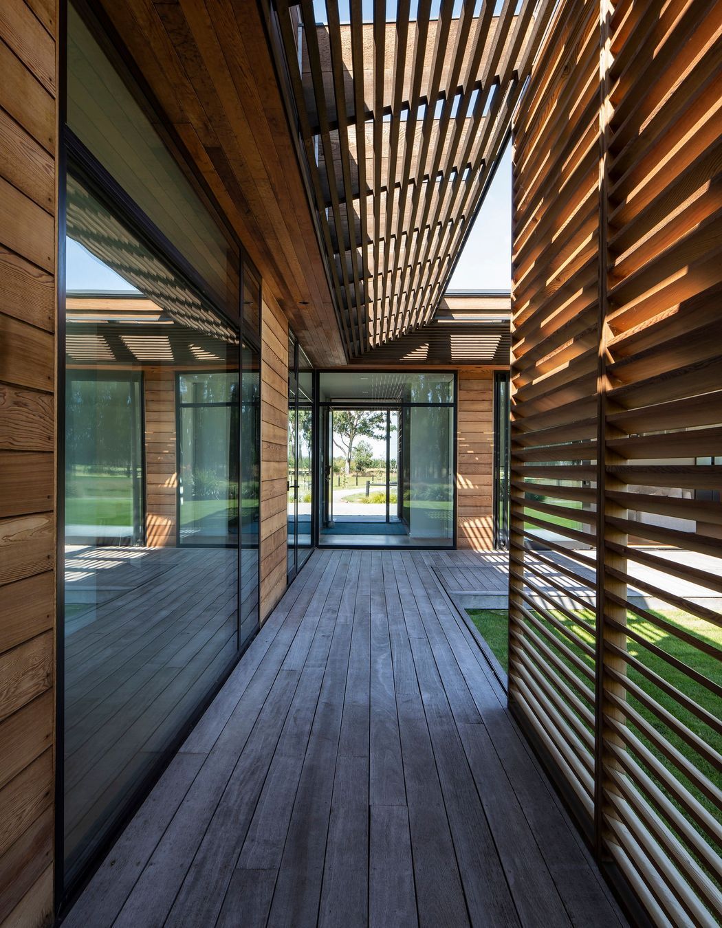 Striking sliding screens provide sun shading and create beautiful shadows throughout the home.